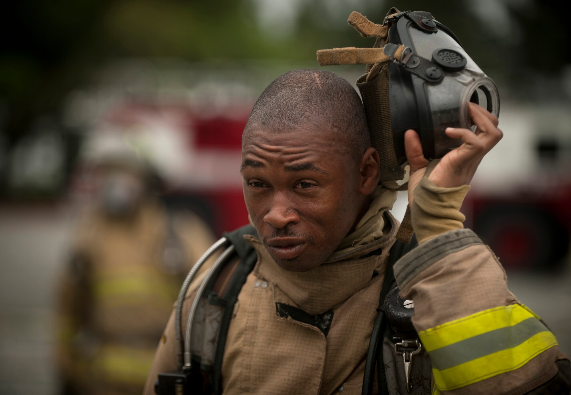 MOODY AIR FORCE BASE, Ga.-- Walter Williams, Valdosta Fire Department firefighter, takes off his mask after participating in a training exercise April  20. Mr. Williams has been a firefighter for three years and spoke of the opportunity saying, “It’s a pleasure to come out and be able to train with members of the Air Force and utilize their facility.” (U.S. Air Force photo/Airman 1st Class Joshua Green)(RELEASED)
