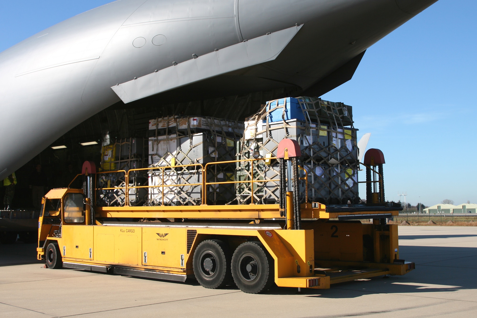 EINDHOVEN, The Netherlands -- Computer equipment is loaded on to a Heavy Airlift Wing C-17. After months of coordination, computers once used in various NATO offices found their way to a school in Afghanistan. Dubbed Aladdin's Lamp, a multi-national crew from the HAW transported more than 24 computers and 130 flat screen monitors from Eindhoven, The Netherlands, to Kandahar. From there, the equipment made its way to a final destination in Kabul and were donated to SOZO, a non-profit charity organization. The computers are now in a SOZO School, where teachers are educating more than 150 students. (Courtesy photo)