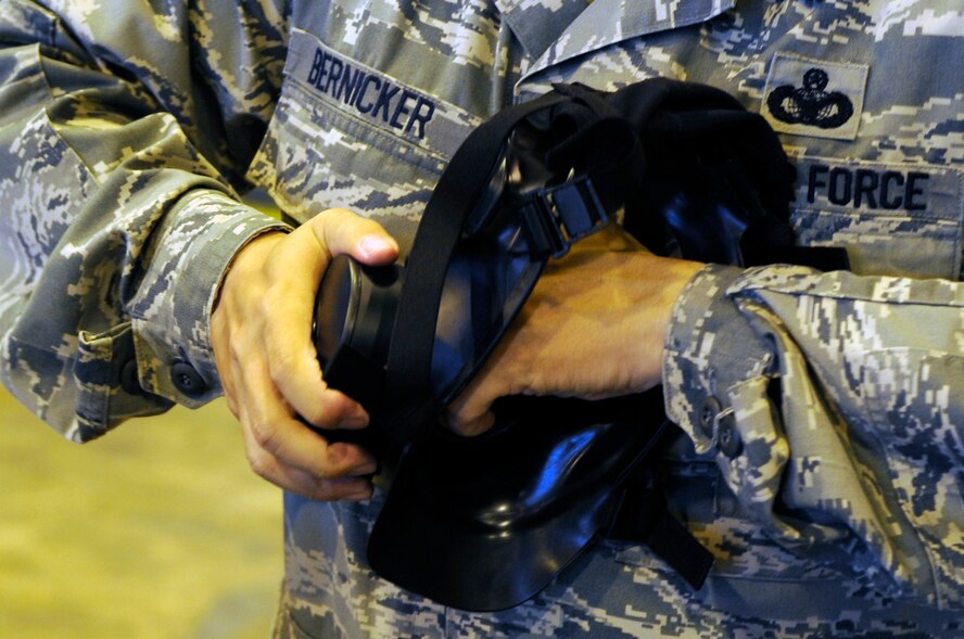 Master Sgt. Albert Bernicker, 2nd Security Forces Squadron, inspects his new M50 gas on Barksdale Air Force Base, La., April 18. The 2 LRS Individual Protective Equipment section issued more than 400 masks to the 2 SFS. (U.S. Air Force photo/Staff Sgt. John Gordinier)