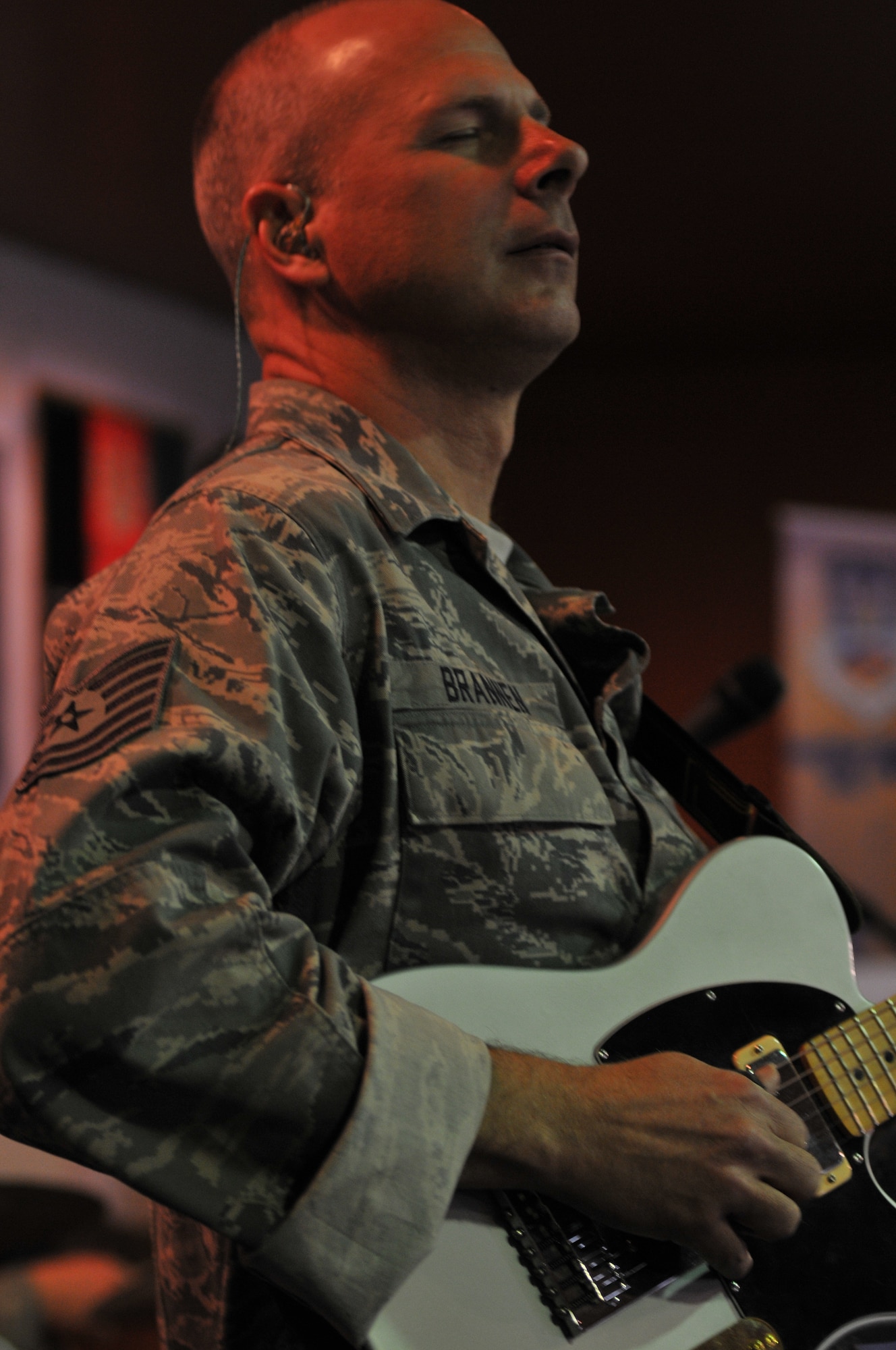 Tech. Sgt. Stephen Brannen of "Wild Blue Country," the U.S. Air Forces Central Band, plays the guitar during a concert for the Airmen of the 438th Air Expeditionary Wing for coming out and listening to them play a set. (U.S. Air Force photo by Tech. Sgt. Brian E. Christiansen)