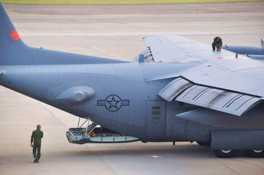 LAUGHLIN AIR FORCE BASE, Texas -- A C-130 aircrew member from the 302nd Air Expeditionary Group conducts a routine inspection before flying missions over Mexico and Texas in support of ongoing efforts to contain wildfires. (U.S. Air Force photo by Senior Airman Scott Saldukas)