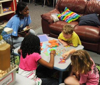 Jade Hampton (left) conducts an art activity with a group of children at the
Joint Base Charleston Youth Center on Joint Base Charleston - Air Base,
S.C., April 21. The Youth Center was recently recognized as the Youth
Program of the Year for the South Carolina Boys and Girls Club of America.
Ms. Hampton is a child and youth program assistant and has been with the
Youth Center for 18 months. (U.S.Air Force photo/ Tech. Sgt. Vernon
Cunningham

