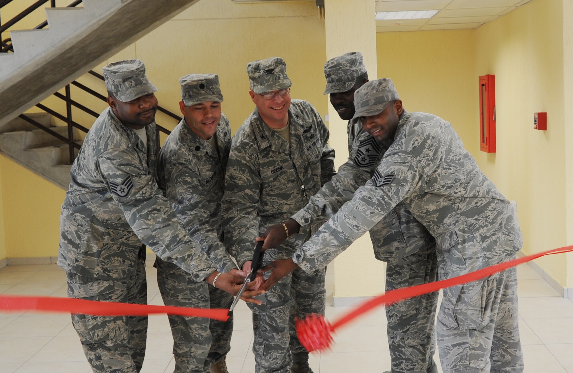 Lt. Col. Dwayne McCullion, the 39th Civil Engineer Squadron commander, Chief Master Sgt. Marcus Snoddy, the 39th Air Base Wing command chief, Staff Sgt. Bradley Nelms, from the 39th Civil Engineer Squadron, and Staff Sgt. Courtney Powell, from the 39th Maintenance Squadron, join Col. Eric Beene, the 39th Air Base Wing commander, to officially reopen a renovated dormitory with a ribbon cutting ceremony April 6, 2011, at Incirlik Air Base, Turkey. The dormitory was originally constructed in 1963 and has had several renovations to keep up with the quality of life standards set by the Air Force. (U.S. Air Force photo by Airman 1st Class Clayton Lenhardt)