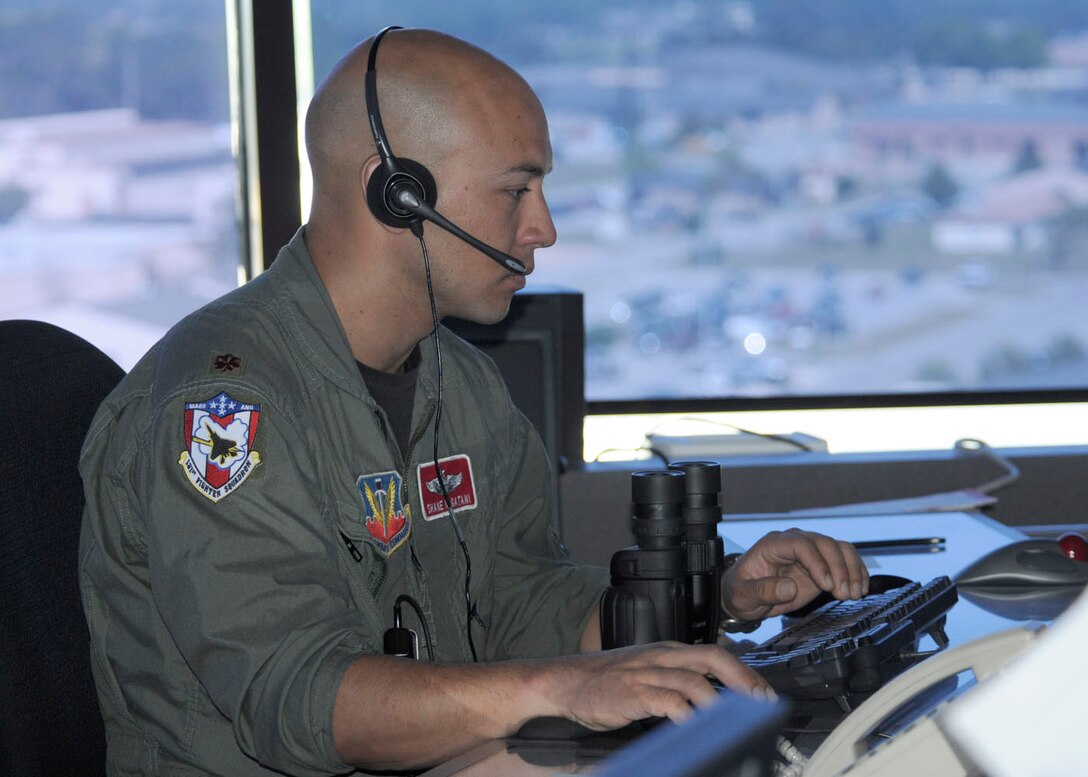 Major Shane Nagatani of the 104th Fighter Wing, Massachusetts Air National Guard works in the Tyndall AFB tower as the Supervisor of Flying during the Weapons System Evaluation Program (WSEP), known as Combat Archer, on April 20, 2011. This training is important for the ground crews to test their maintenance systems and processes while loading live munitions on the F-15 eagle, as well as critical live war fighting training for the F-15 pilots to employ air-to-air missiles against real world targets.  (U.S.A.F. photograph by Senior Master Sgt. Robert J. Sabonis)