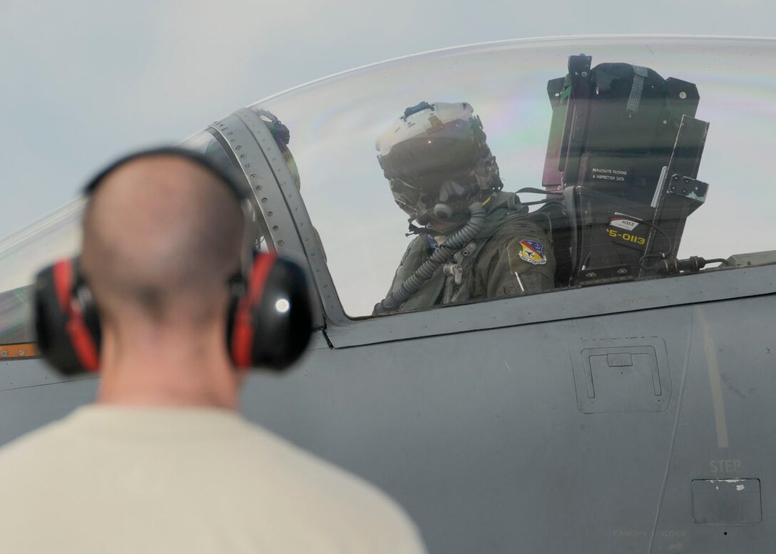 Col. James Keefe, Vice Commander of the 104th Fighter Wing, Massachusetts Air National Guard prepares for takeoff in the unit’s F-15 aircraft to participate in the Weapons System Evaluation Program (WSEP), known as Combat Archer, on April 20, 2011. This training is important for the ground crews to test their maintenance systems and processes while loading live munitions on the F-15 eagle, as well as critical live war fighting training for the F-15 pilots to employ air-to-air missiles against real world targets. He is wearing the Joint Helmet Mounted Cueing System (JHMCS) helmet. (U.S.A.F. photograph by Senior Master Sgt. Robert J. Sabonis)