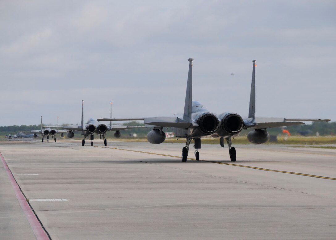 Airman 1st Class Steven Eckman of the 104th Fighter Wing, Massachusetts Air National Guard assists pilot Col. Kenneth Lambrich for takeoff in the unit’s F-15 aircraft to participate in the Weapons System Evaluation Program (WSEP), known as Combat Archer, on April 20, 2011. This training is important for the ground crews to test their maintenance systems and processes while loading live munitions on the F-15 eagle, as well as critical live war fighting training for the F-15 pilots to employ air-to-air missiles against real world targets.  (U.S.A.F. photograph by Senior Master Sgt. Robert J. Sabonis)