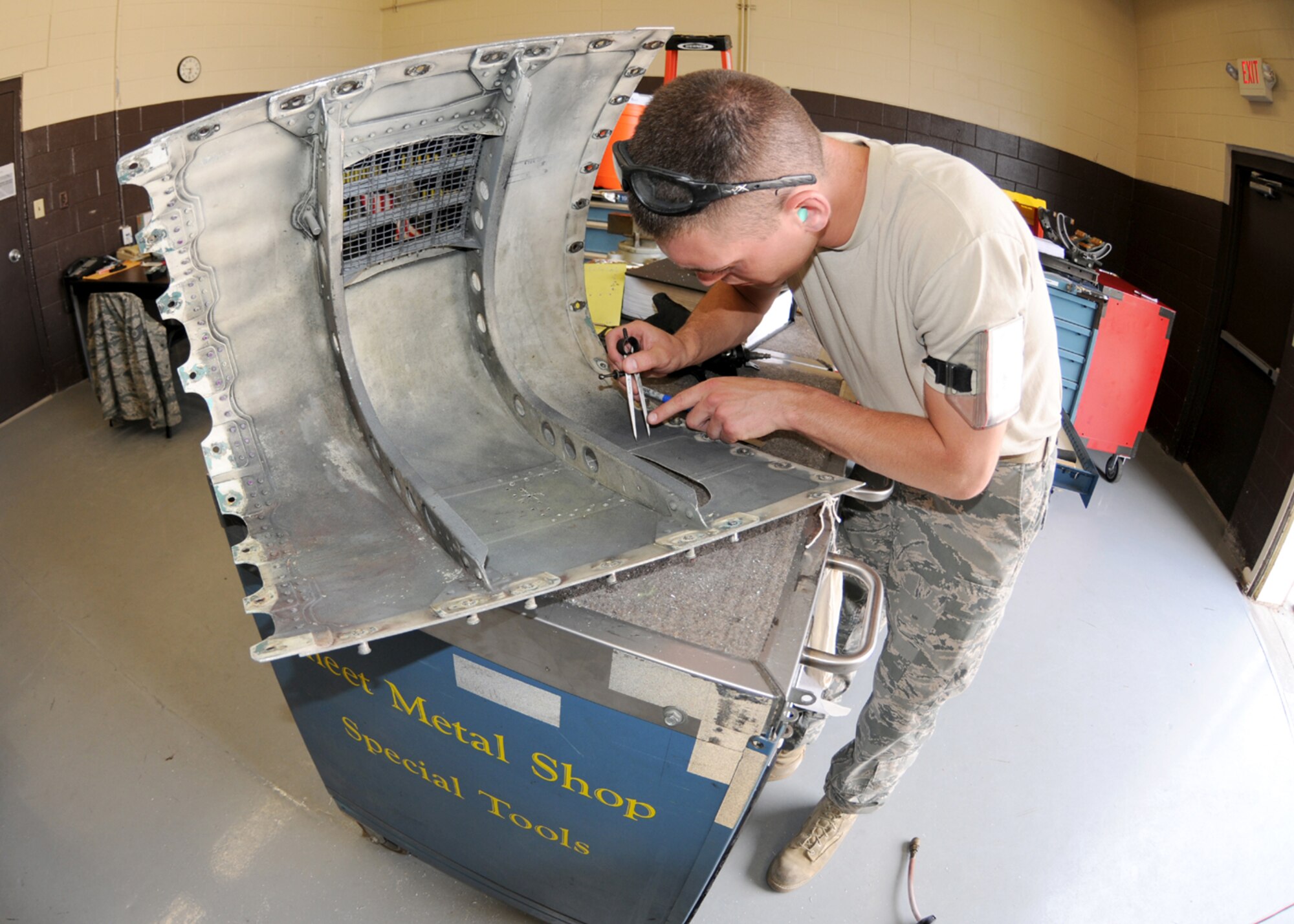 Staff Sgt.Nathan Poudrier from the Structural Maintenance shop 104th Fighter Wing Westfield Massachusetts, measure for a patch on the cracked gun panel at Tyndall Air Force Base, Fla on April 20, 2011.This gun panel was found cracked after on an F-15 aircraft after an exercise flight. While they are deployed to Tyndall Air Force Base in Florida, they are participating in the Weapons System Evaluation Program (WSEP).  (U.S. Air Force Photo by: Technical Sergeant, Melanie J. Casineau)

