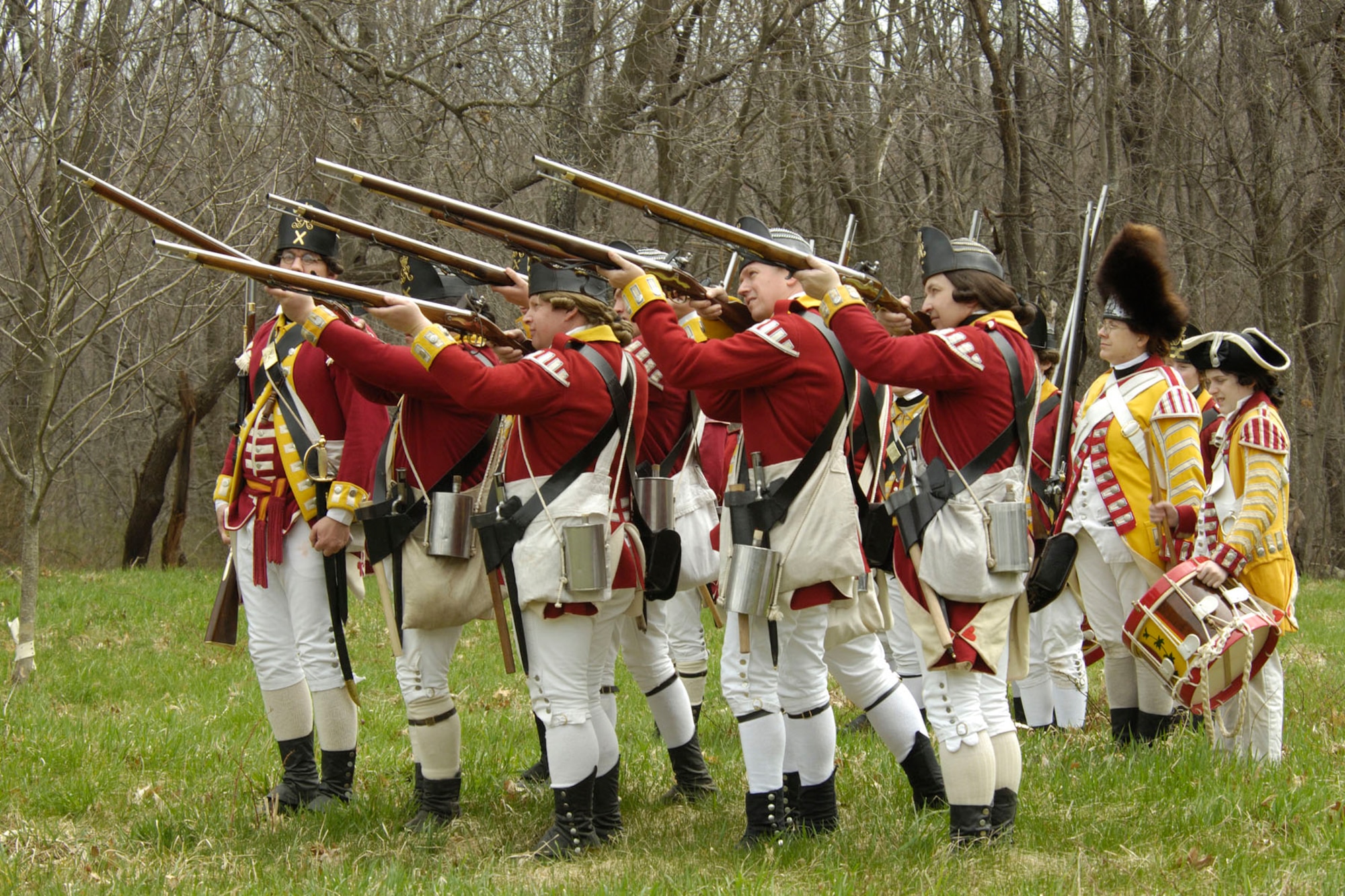 British Regulars reenactors fire shots during Patriots Day activities on April 18. Towns around the area commemorated the opening battles of the Revolutionary War with reenactments, parades and more. (U.S. Air Force photo by Linda LaBonte Britt)