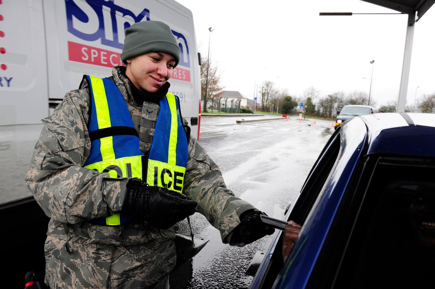 Airman First Class Brianna Murph, Security Forces Journeyman, 423rd Security Forces Squadron, performs a security check at RAF Alconbury. (U.S. Air Force photo by Tech. Sgt. John Barton) 