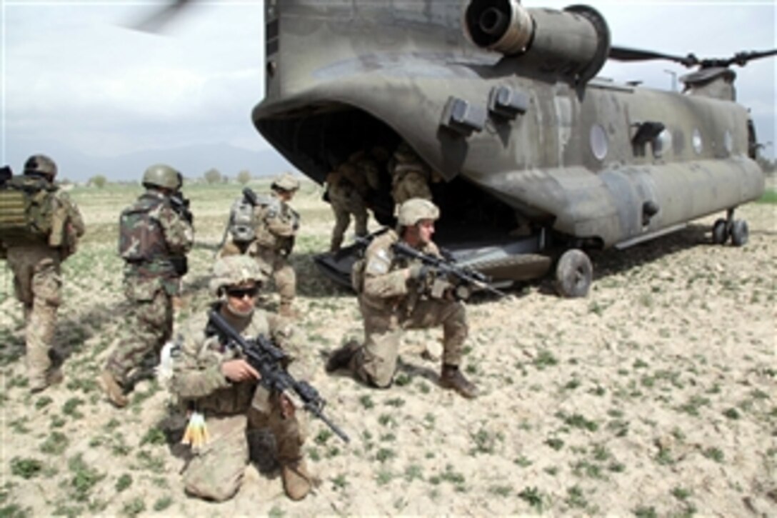 U.S. Army soldiers with 1st Battalion, 6th Field Artillery Regiment, 3rd Brigade, 1st Infantry Division, Focused Targeting Force, board a CH-47 Chinook helicopter in Khowst province, Afghanistan, on March 29, 2011.  