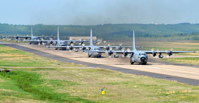 C-130's taxi April 14, 2011, at Little Rock Air Force Base, Ark., to take off from the base's runway during the combat surge week. The purpose of the surge week was to make up for lost flying time by increasing the operations tempo.  (U.S. Air Force photo by Airman 1st Class Rusty Frank)