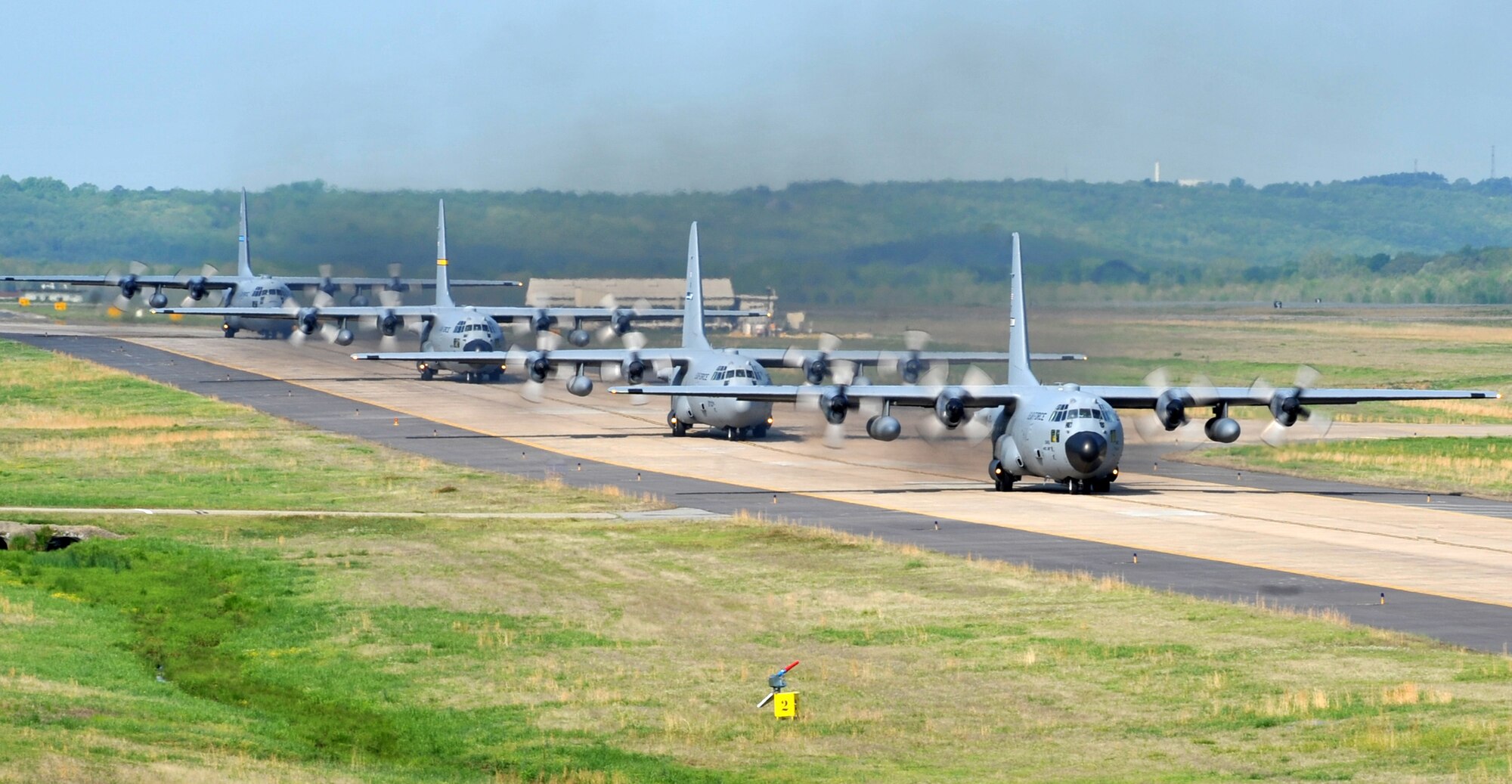 C-130’s taxi April 14, 2011, at Little Rock Air Force Base, Ark., to take off from the base’s runway during the combat surge week. The purpose of the surge week was to make up for lost flying time by increasing the operations tempo.  (U.S. Air Force photo by Airman 1st Class Rusty Frank)