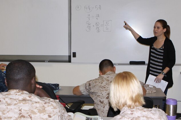 Students enrolled in the Military Academic Skills Program study math equations at the Joint Education Center aboard Camp Pendleton, April 21. The MASP is just one educational program the JEC offers, in addition to more than a dozen free college opportunities. For more information contact the JEC on mainside at 760-725-6660 in building 1331 or their office located at the School of Infantry at 760-725-0606 in building 520512.