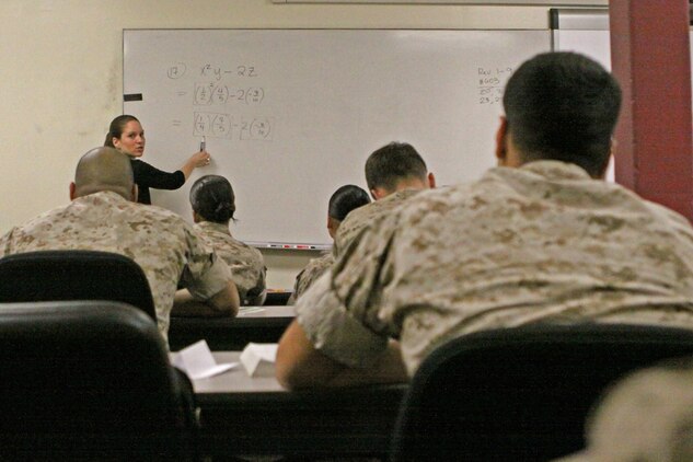Jena Hayes, an instructor at the Joint Education Center, Marine Corps Base Camp Pendleton, teaches students enrolled in the Military Academic Skills Program math equations at the Joint Education Center, April 21. The MASP is just one educational program the JEC offers in conjunction with more than a dozen colleges to choose from and several other free educational courses of action for military and their spouses.