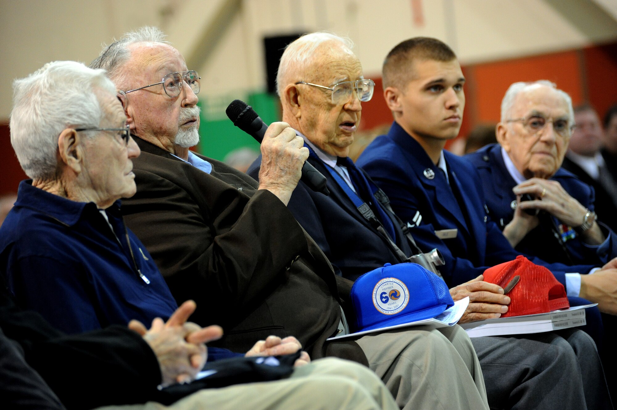 Fred Parish (second from left) speaks to the audience in attendance for the 70th anniversary celebration of the Oregon Air National Guard held at the Portland Air National Guard Base, Portland, Ore., on April 15, 2011. Parish is one of seven original members in attendance, of the 123rd Observation Squadron, which was formed in April of 1941. (U.S. Air Force photograph by Tech. Sgt. John Hughel, 142nd Fighter Wing Public Affairs)