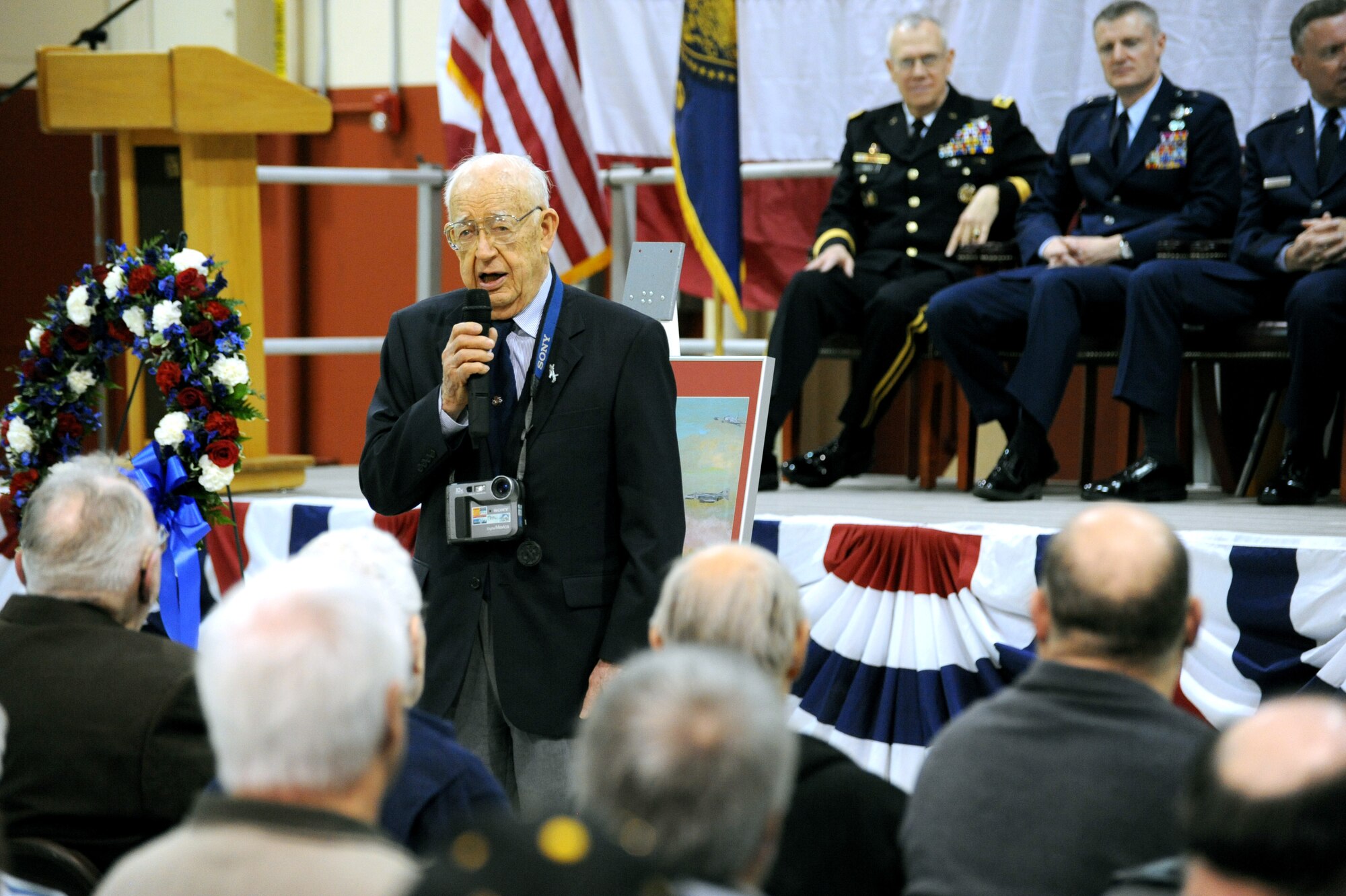 Oregon National Guard veteran Fred Hill, a photographer with a B-25 photo reconnaissance unit in the South Pacific, shares one of his memorable moments during World War II, during the 70th Anniversary celebration held at the Portland Air National Guard Base, Portland, Ore., April 15, 2011. Hill was on of the original members of the 123rd Observation squadron and is one of 8 surviving members of Oregon's first National Guard aviation units formed before World War II. (U.S. Air Force photograph by Tech. Sgt. John Hughel, 142nd Fighter Wing Public Affairs)