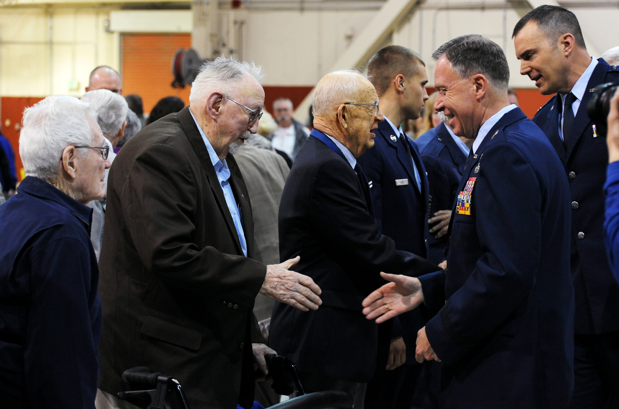 Fred Parish (left) is greeted by Brig. Gen. Bruce Prunk (right), Assistant Adjutant General for the Oregon Air National Guard, during the 70th Anniversary celebration held at the Portland Air National Guard Base, Portland, Ore., on April 15, 2011. Parish is one of the original members of the 123rd Observation Squadron that was formed in April of 1941. (U.S. Air Force photograph by Tech. Sgt. John Hughel, 142nd Fighter Wing Public Affairs)