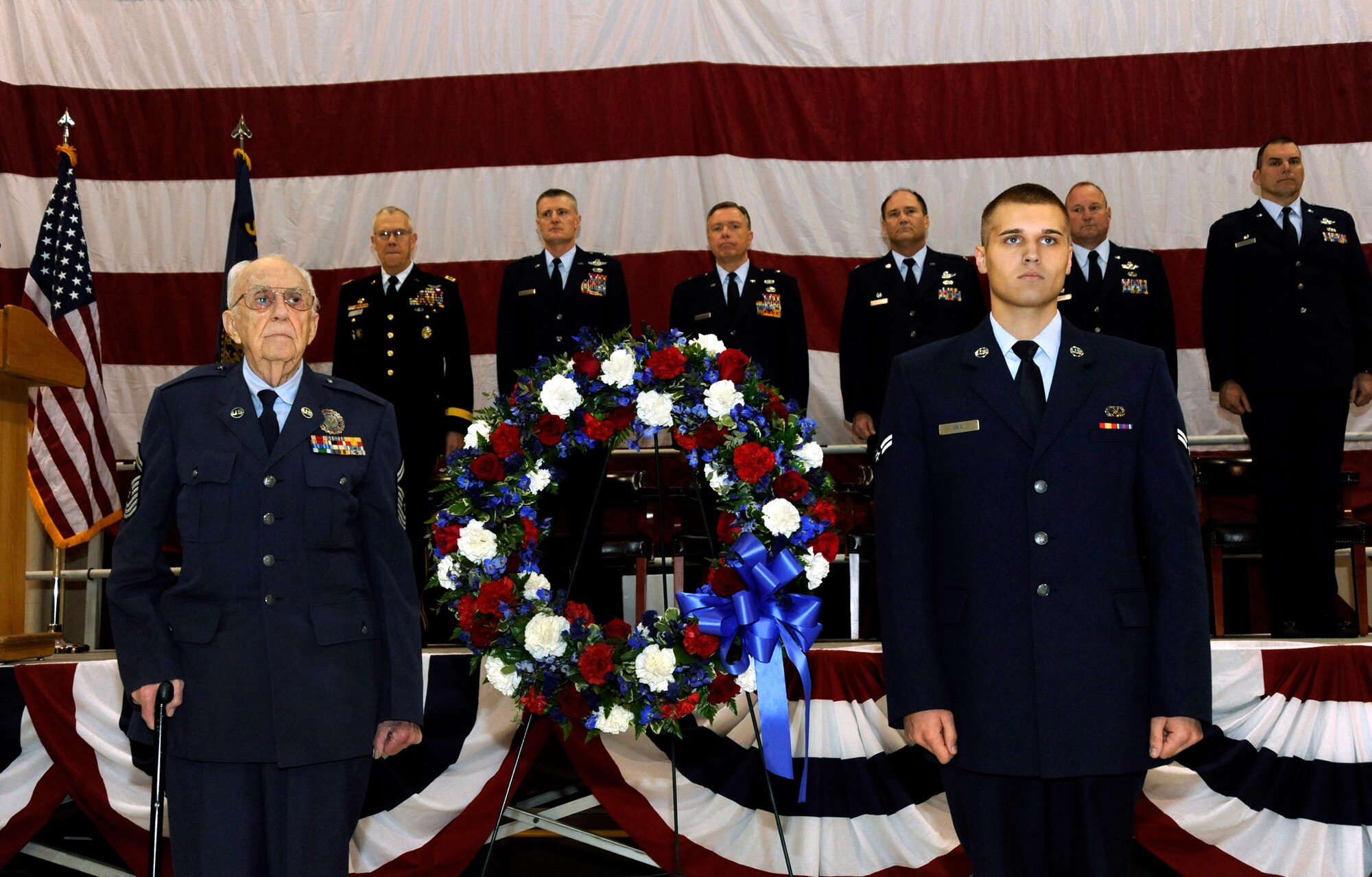Oregon Air National Guard retired Chief Master Sgt. Jack Klein (left) and Airman 1st Class Elliot Gile, (right) participate in a wreath-laying ceremony during the Oregon Air National Guard's 70th Anniversary celebration at the Portland Air National Guard Base, in Portland, Ore., April 15, 2011.  Gile, a crew chief with the 142nd Fighter Wing, Oregon Air National Guard, is the newest member of the Oregon Air National Guard while Klein was the first Oregon Air National Guard recruiter and served with the 142nd Aircraft Control and Warning Squadron as a radar operator. (U.S. Air Force photograph by Tech. Sgt. John Hughel, 142nd Fighter Wing Public Affairs)