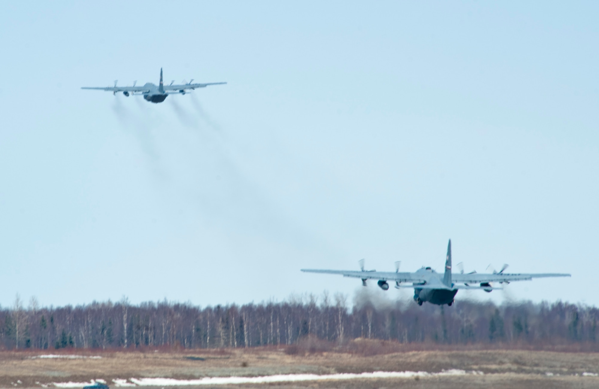 JOINT BASE ELMENDORF-RICHARDSON, Alaska -- Two C-130 Hercules take off April 18 from JBER. The 39th and 40th Airlift Squadrons from Dyess Air Force Base, Texas have three C-130s and approximately 120 Airmen at JBER for Red Flag-Alaska. RF-Alaska is a Pacific Air Forces-directed field training exercise for the U.S. and coalition forces flown under simulated air combat conditions. It is conducted on the Joint Pacific Alaskan Range Complex, the largest air-ground training complex in America. (Air Force photo/Senior Airman Christopher Gross)