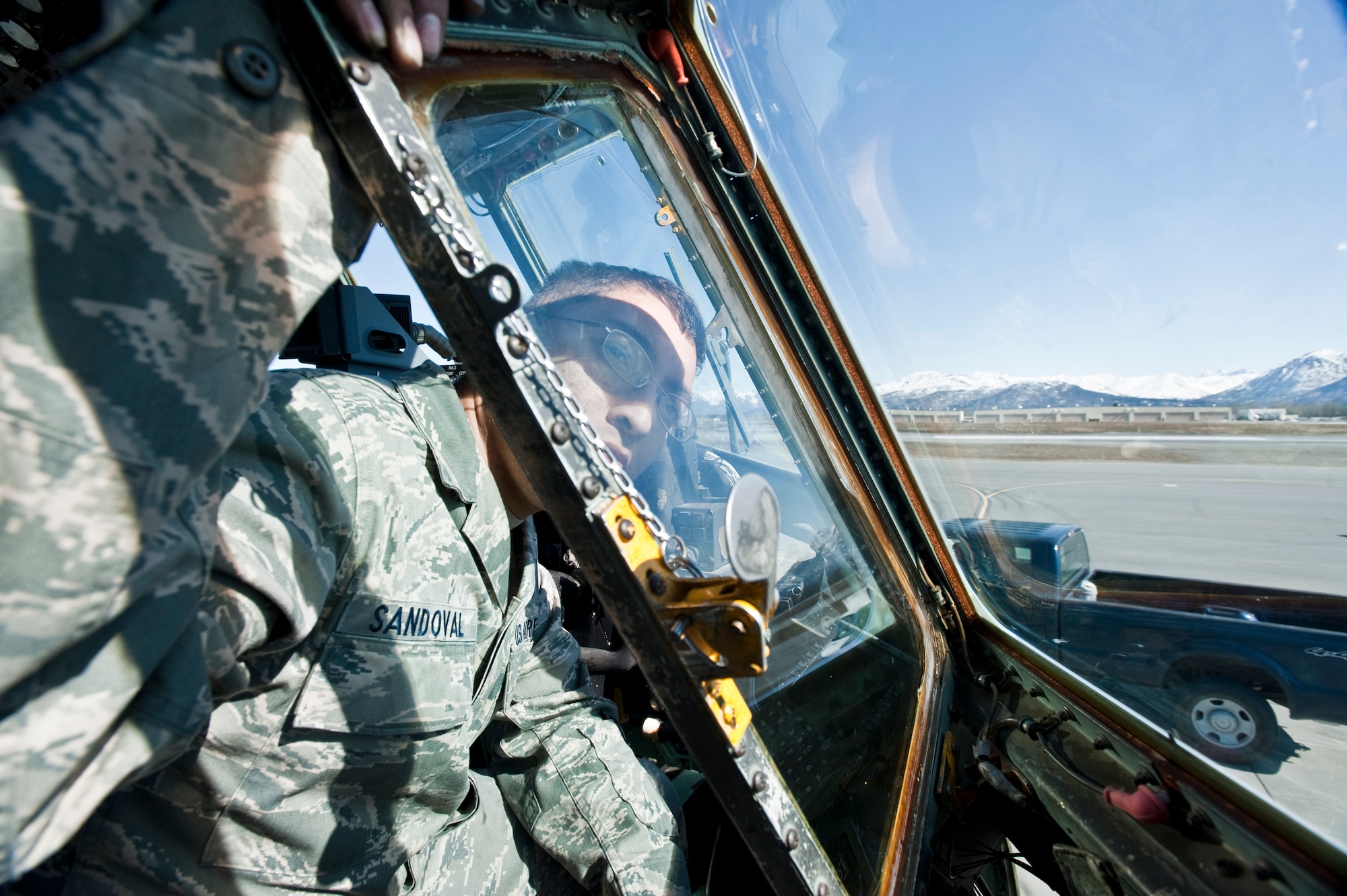 JOINT BASE ELMENDORF-RICHARDSON, Alaska -- Staff Sgt. Anthony Sandoval, 317th Aircraft Maintenance Squadron, adjust a propeller from the cockpit of a C-130 Hercules April 15. The 317th AMXS is part of the 39th and 40th Airlift Squadrons from Dyess Air Force Base, Texas. The squadron has three C-130s and approximately 120 Airmen at JBER for Red Flag-Alaska. RF-Alaska is a Pacific Air Forces-directed field training exercise for the U.S. and coalition forces flown under simulated air combat conditions. It is conducted on the Joint Pacific Alaskan Range Complex, the largest air-ground training complex in America. (Air Force photo/Senior Airman Christopher Gross)