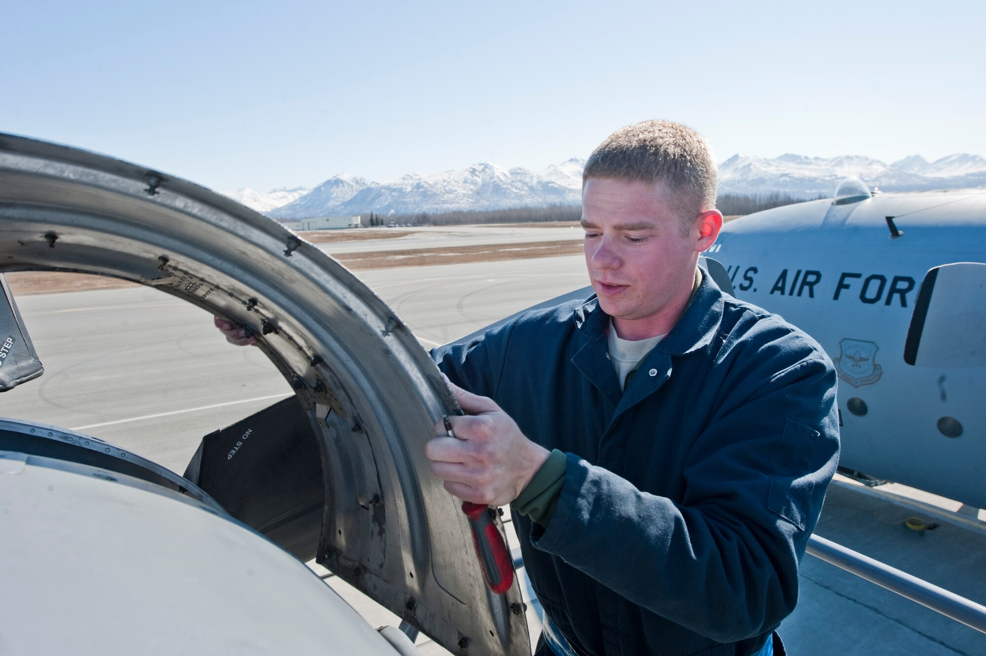JOINT BASE ELMENDORF-RICHARDSON, Alaska -- Airman 1st Class Keith Loughry, 317th Aircraft Maintenance Squadron, works on a propeller of a C-130 Hercules April 15. The 317th AMXS is part of the 39th and 40th Airlift Squadrons from Dyess Air Force Base, Texas. The squadron has three C-130s and approximately 120 Airmen at JBER for Red Flag-Alaska. RF-Alaska is a Pacific Air Forces-directed field training exercise for the U.S. and coalition forces flown under simulated air combat conditions. It is conducted on the Joint Pacific Alaskan Range Complex, the largest air-ground training complex in America. (Air Force photo/Senior Airman Christopher Gross)