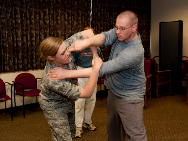 HOLLOMAN AIR FORCE BASE, N.M. -- Senior Airman Sondra Escutia, 49th Wing, practices an escape technique with Staff Sgt. Ollen Johnson, 49th Maintenance Squadron, during a Training for Life self-defense class at the Community Activity Center April 13, 2011. The class educated participants on multiple low-liability ways to avoid and escape a bad situation and was held in conjunction with Sexual Assault Awareness Month. (Photo by Tracey Spencer /Released)