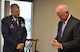 Col. Timothy Tarchick, 94th Airlift Wing Commander, presents Sen. Saxby Chambliss with a unit coin April 20, 2011 in recognition of the support the senator has provided to service members stationed at Dobbins Air Reserve Base, Ga. Colonel Tarchick met with the senator at his regional office in Atlanta to discuss current and future operations involving Airmen assigned to Dobbins Air Reserve Base, Ga.