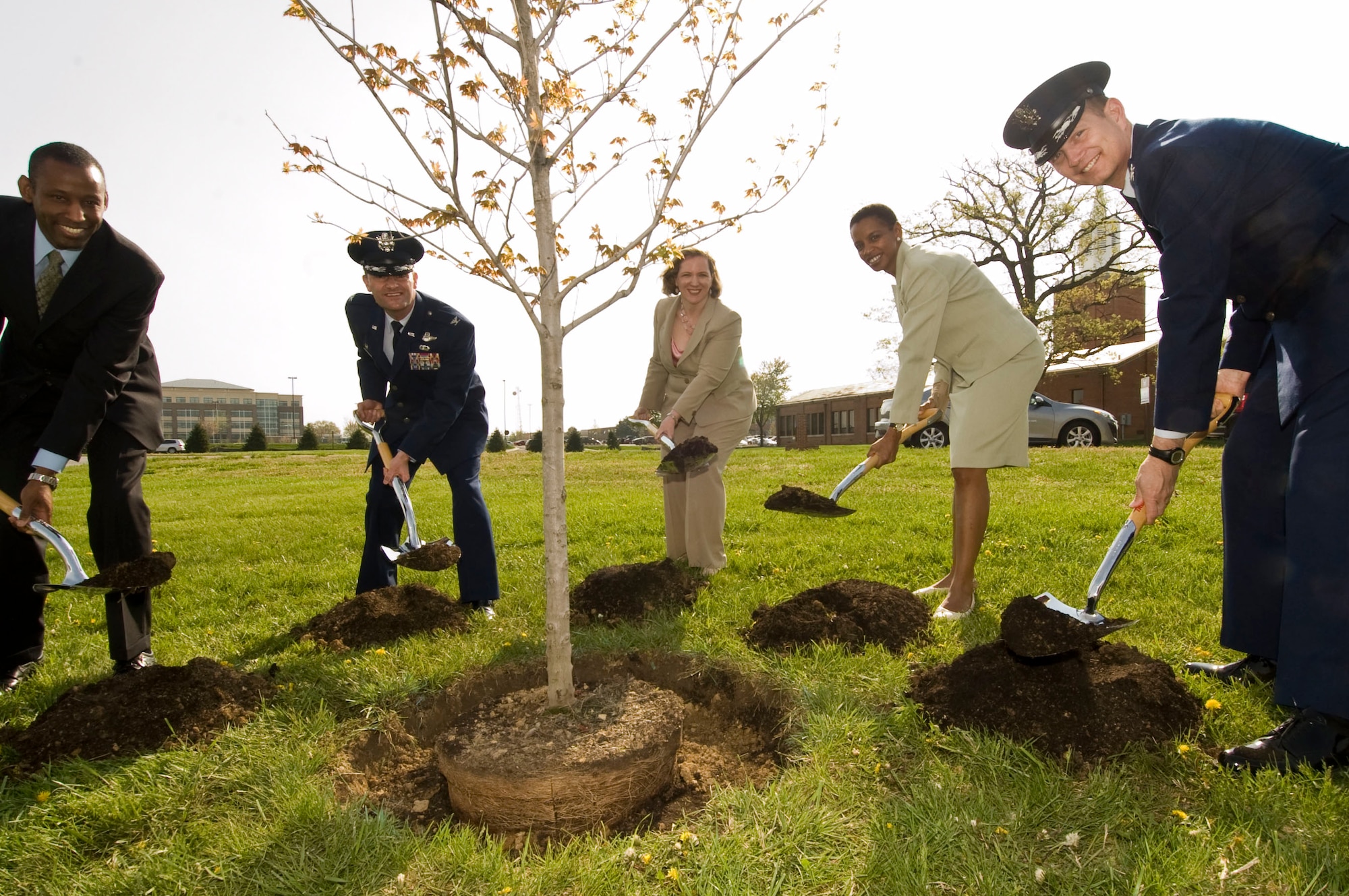 JOINT BASE ANDREWS, Md. – From left, Timothy Bridges, Deputy Assistant Secretary of the Air Force for Environmental Safety and Occupational Health; Col. Ken Rizer, 11th Wing/Joint Base Andrews commander; Erin Conaton, Under Secretary of the Air Force; Rep. Donna F. Edwards, Maryland 4th Congressional District; and Col. Phillip Gibbons, Air Force District of Washington vice commander, shovel soil to plant a red maple sapling during the Earth Day observance kickoff here April 20, 2011. During the ceremony, Ms. Conaton addressed attendees and emphasized the Air Force’s commitment to good stewardship of the natural resources the service depends upon today to ensure a secure tomorrow.  (U.S. Air Force Photo/Bobby Jones)

