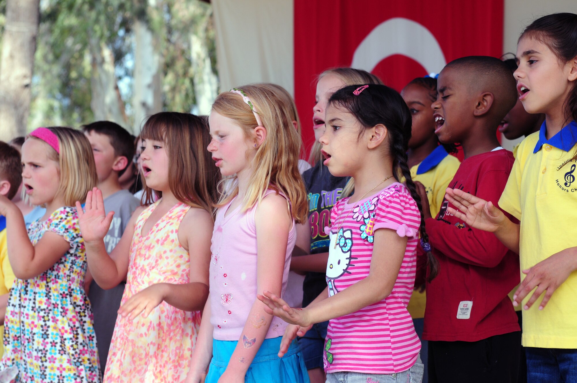 Children from the Incirlik Unit School perform at a Children's Day festival April 17, 2011, at Incirlik Air Base, Turkey. The event was hosted by the Turkish air force 10th Tanker Command and was open to all Incirlik personnel. The event offered an opportunity for camaraderie and partnership-building for all personnel here, and was a chance to celebrate both Turkish children on their national holiday and military children during the Month of the Military Child, officials said.  (U.S. Air Force photo by 1st Lt. Gina McKeen/Released)