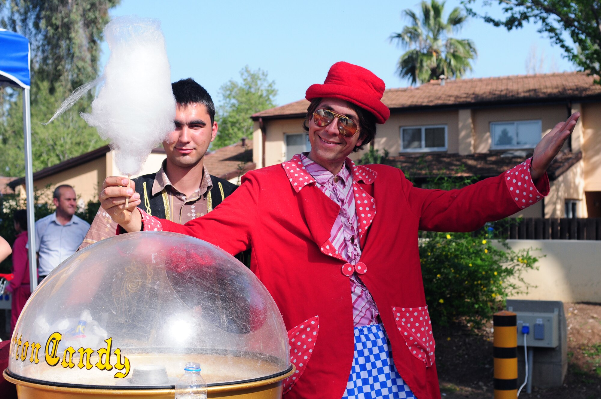 A clown prepared cotton candy for festival attendees at a Children's Day festival April 17, 2011, at Incirlik Air Base, Turkey. The event was hosted by the Turkish air force 10th Tanker Command and was open to all Incirlik personnel. The event offered an opportunity for camaraderie and partnership-building for all personnel here, and was a chance to celebrate both Turkish children on their national holiday and military children during the Month of the Military Child, officials said.  (U.S. Air Force photo by 1st Lt. Gina McKeen/Released)