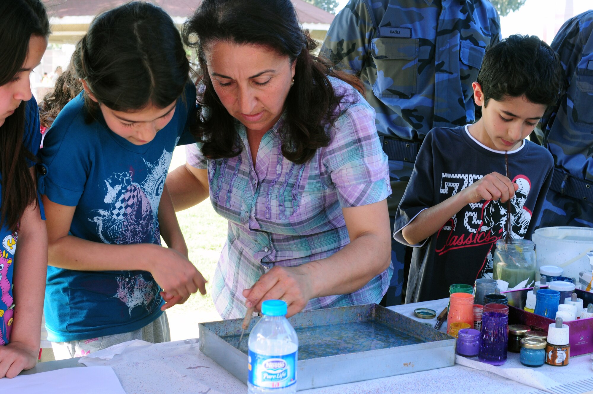Children learn Turkish painting techniques during a Children's Day festival April 17, 2011, at Incirlik Air Base, Turkey. The event was hosted by the Turkish air force 10th Tanker Command and was open to all Incirlik personnel. The event offered an opportunity for camaraderie and partnership-building for all personnel here, and was a chance to celebrate both Turkish children on their national holiday and military children during the Month of the Military Child, officials said.  (U.S. Air Force photo by 1st Lt Gina McKeen/Released)