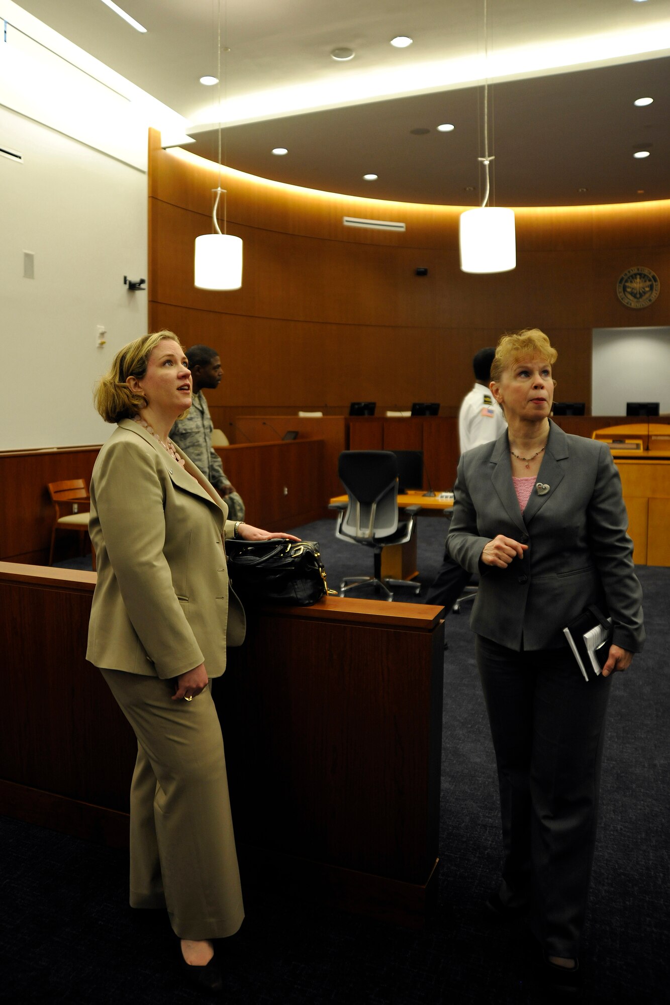 Susan Bench-Snow, Secretary of the Air Force Administrative Assistant Facilities director, shows Under Secretary of the Air Force Erin Conaton the new appellate court room inside the William A. Jones III Building, following an Earth Day and Arbor Day tree planting ceremony at Joint Base Andrews, Md., April 20, 2011. The building features two court rooms, one for base legal services and the other for Air Force appeals. (U.S. Air Force photo/ Senior Airman Melissa V. Brownstein)
