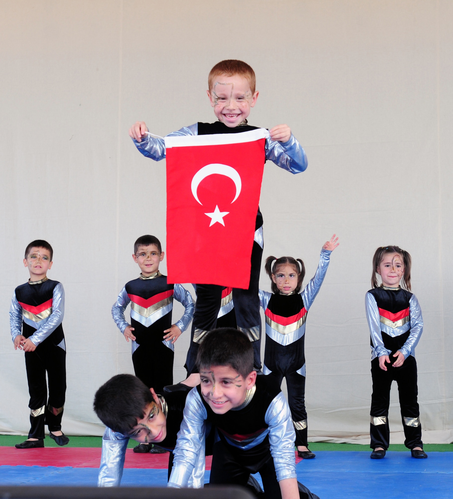 Children give gymnastics demonstrations during a Children?s Day festival April 17, 2011, at Incirlik Air Base, Turkey. The event was hosted by the Turkish air force 10th Tanker Command and was open to all Incirlik personnel. The event offered an opportunity for camaraderie and partnership-building for all personnel here, and was a chance to celebrate both Turkish children on their national holiday and military children during the Month of the Military Child, officials said.  (U.S. Air Force photo by 1st Lt Gina McKeen/Released)