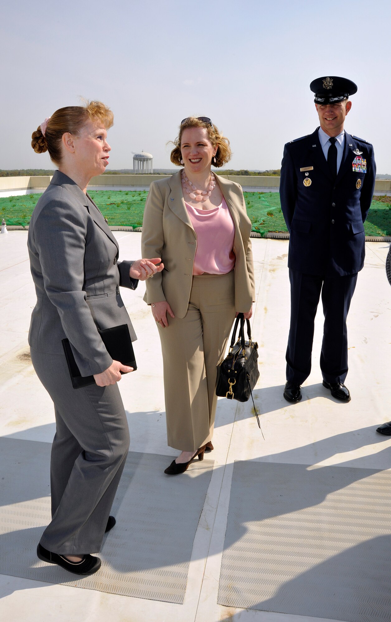 (From left) Susan Bench-Snow, Secretary of the Air Force Administrative Assistant Facilities director, Erin Conaton, Under Secretary of the Air Force, and Col. Phillip Gibbons, Air Force District Washington vice commander, tour the green roof of the new William A. Jones III Building, following an Earth Day and Arbor Day tree planting ceremony at Joint Base Andrews, Md., April 20, 2011. The new Jones building is constructed of more than 20 percent recycled material and features storm water recycling systems and green roofing which will help make the infrastructure energy efficient.  These features will save the Air Force 44.7 percent annually on energy costs compared to the offices the new building replaces.  (U.S. Air Force photo/ Senior Airman Melissa V. Brownstein)