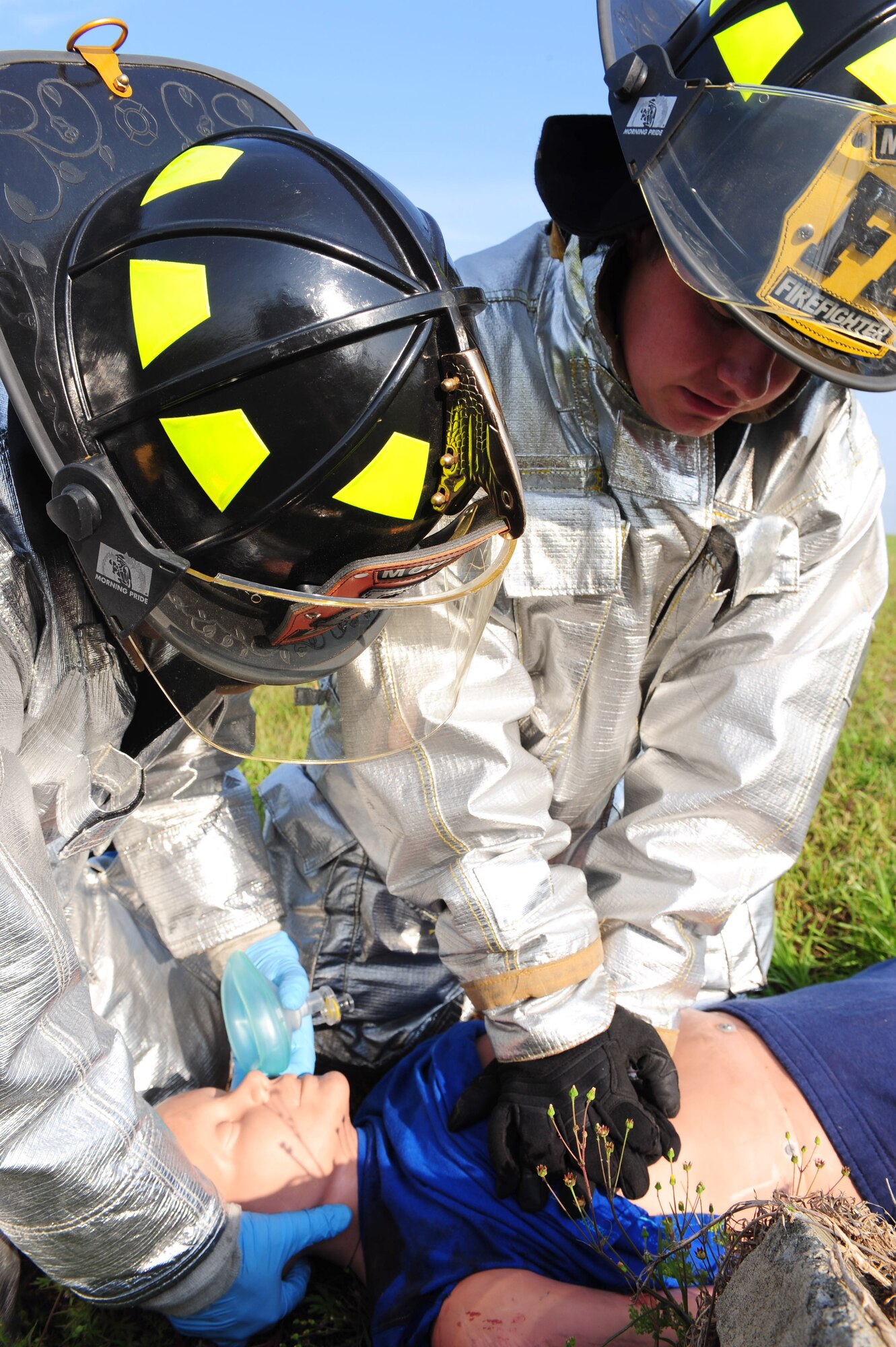Airman 1st Class Gary Simmons and Senior Airman Serafin Rosa, 23rd Civil Engineer Squadron firefighters, performed a two-person cardiopulmonary resuscitation on the victim during Hurricane Evacuation Exercise April 21 at Moody Air Force Base, Ga. Airman Simmons does chest compressions while Airman Rosa performs the head-tilt chin-lift.  (U.S. Air Force photo/Senior Airman Stephanie Mancha)(RELEASED)