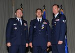 Staff Sgts. John W. Hatzidakis (center) and Christopher Nilson, pararescue Airmen with the 342nd Training Squadron, received Air Medals from Lt. Gen. Douglas H. Owens, Air Education and Training Command vice commander, during an awards presentation at Forbes Hall April 18. (U.S. Air Force photo/Alan Boedeker)