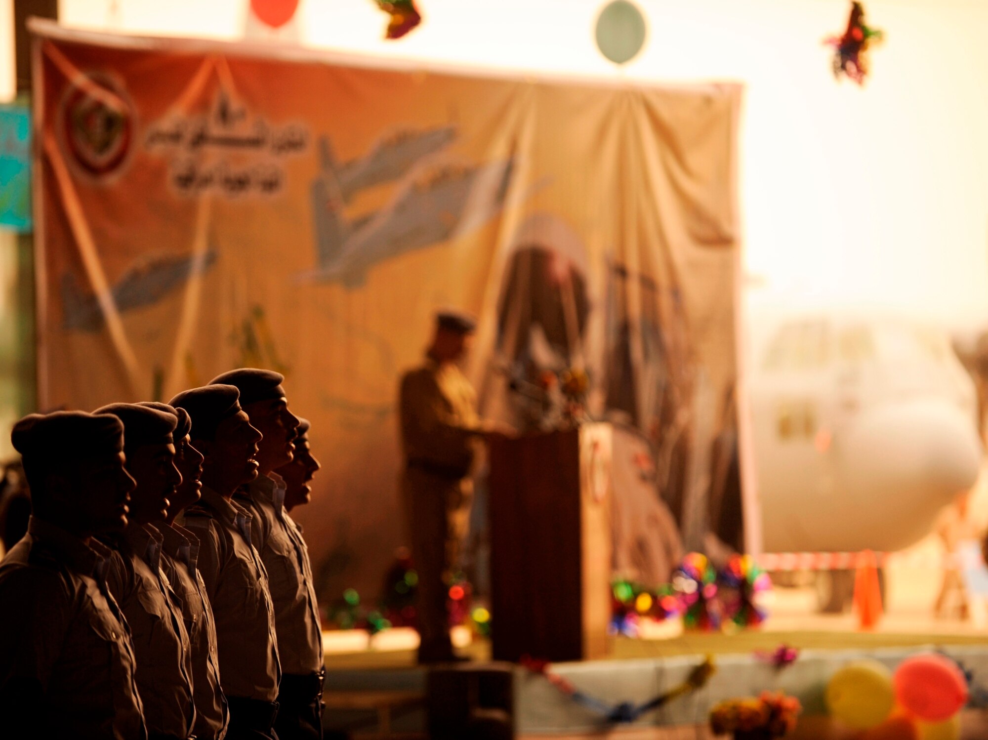 NEW AL-MUTHANA AIR BASE, Iraq -- Iraqi rotary wing pilots cite the oath of allegiance during the Iraqi air force's 80th anniversary celebration here April 21. The anniversary event included speeches from various high level IqAF officials and dignitaries as well as a graduation ceremony for more than a dozen rotary wing pilots. (U.S. Air Force/Tech. Sgt. Jason Lake)