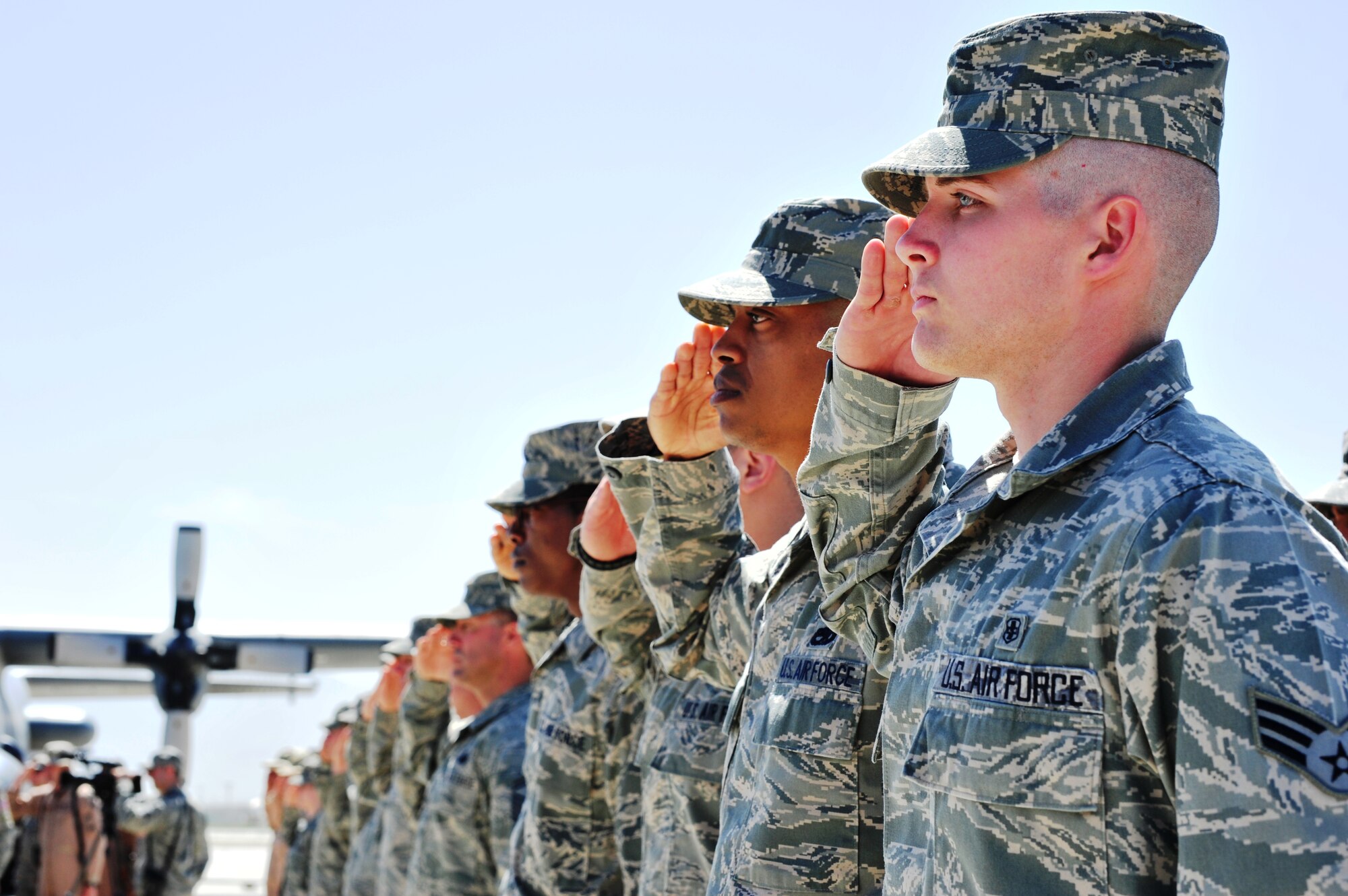 Airmen of the 455th Air Expeditionary Wing salute during the wing change of command ceremony at Bagram Airfield, Afghanistan, April 22, 2011. 