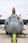 LAUGHLIN AIR FORCE BASE, Texas -- Maintenance personnel from the 302nd Airlift Wing at Peterson Air Force Base, Colo., conduct routine inspections on two C-130s here April 18. The Airmen are currently here in support of the ongoing efforts to contain wildfires in Mexico and Texas. (U.S. Air Force photo by Senior Airman Scott Saldukas)