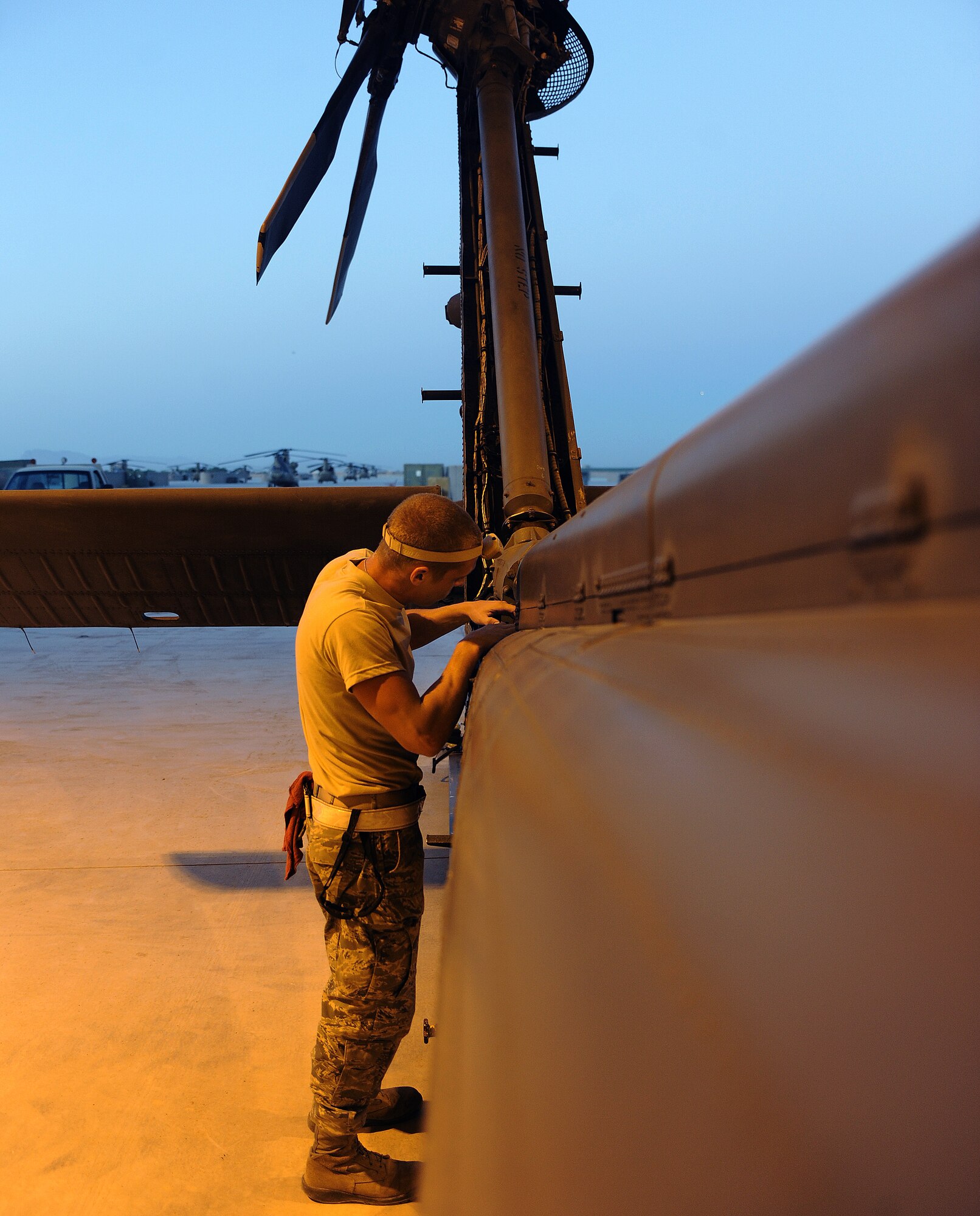 Airman 1st Class Anthony Phillipp inspects the tail of an HH-60 Pave Hawk April 18, 2011, at Kandahar Airfield, Afghanistan. The inspection was part of a 300-hour routine analysis of the aircraft. Airman Phillipp is a crew chief assigned to the 55th Expeditionary Helicopter Maintenance Unit. (U.S. Air Force photo/Senior Airman Willard E. Grande II)