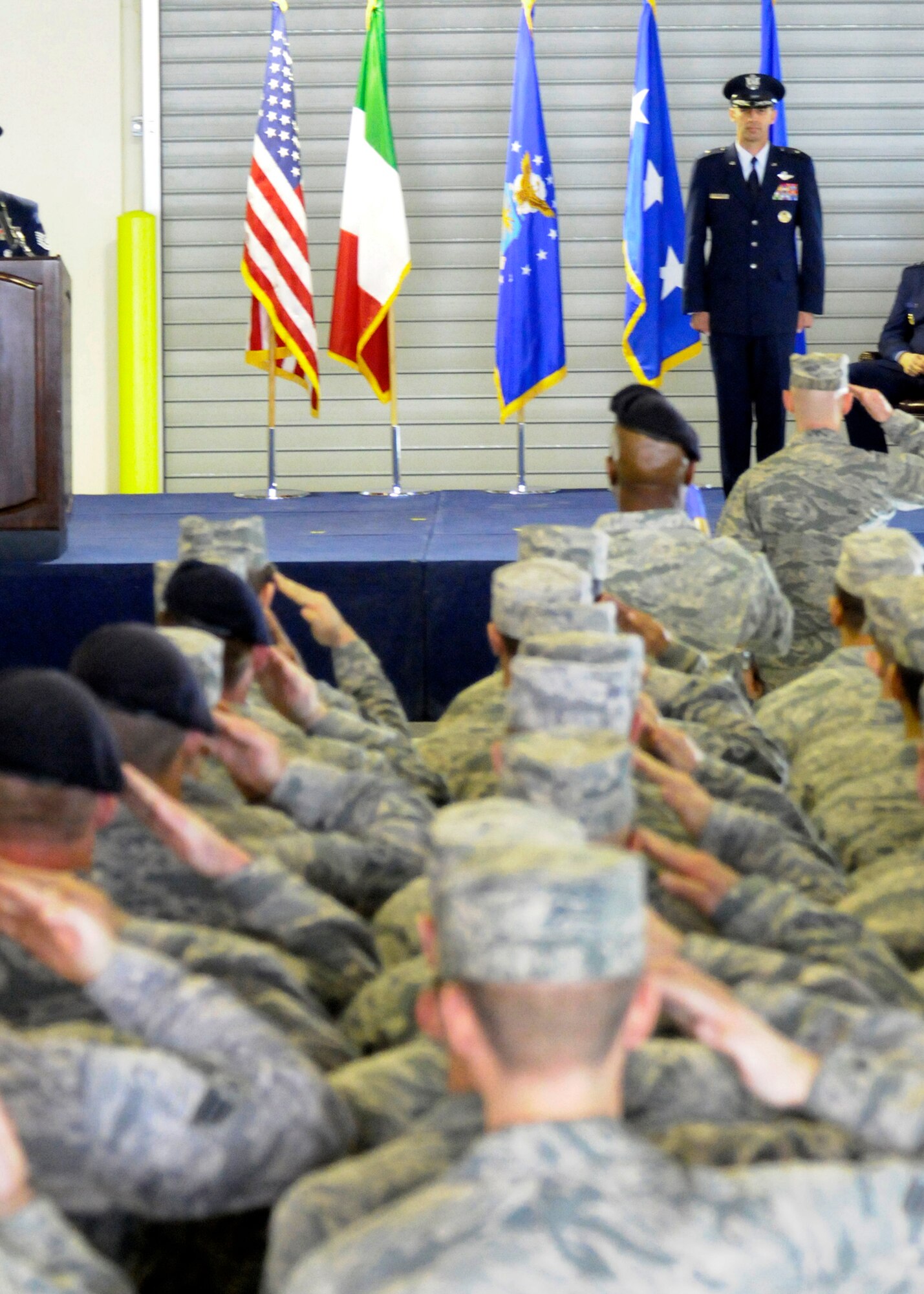 The 31st Fighter Wing renders a salute to Brig. Gen. Scott Zobrist, 31st FW commander, during the wing change of command ceremony April 22 at Aviano Air Base, Italy. General Zobrist was the 388th Fighter Wing commander at Hill Air Force Base, Utah. (U.S. Air Force photo/ Airman Brianna N. Jones)