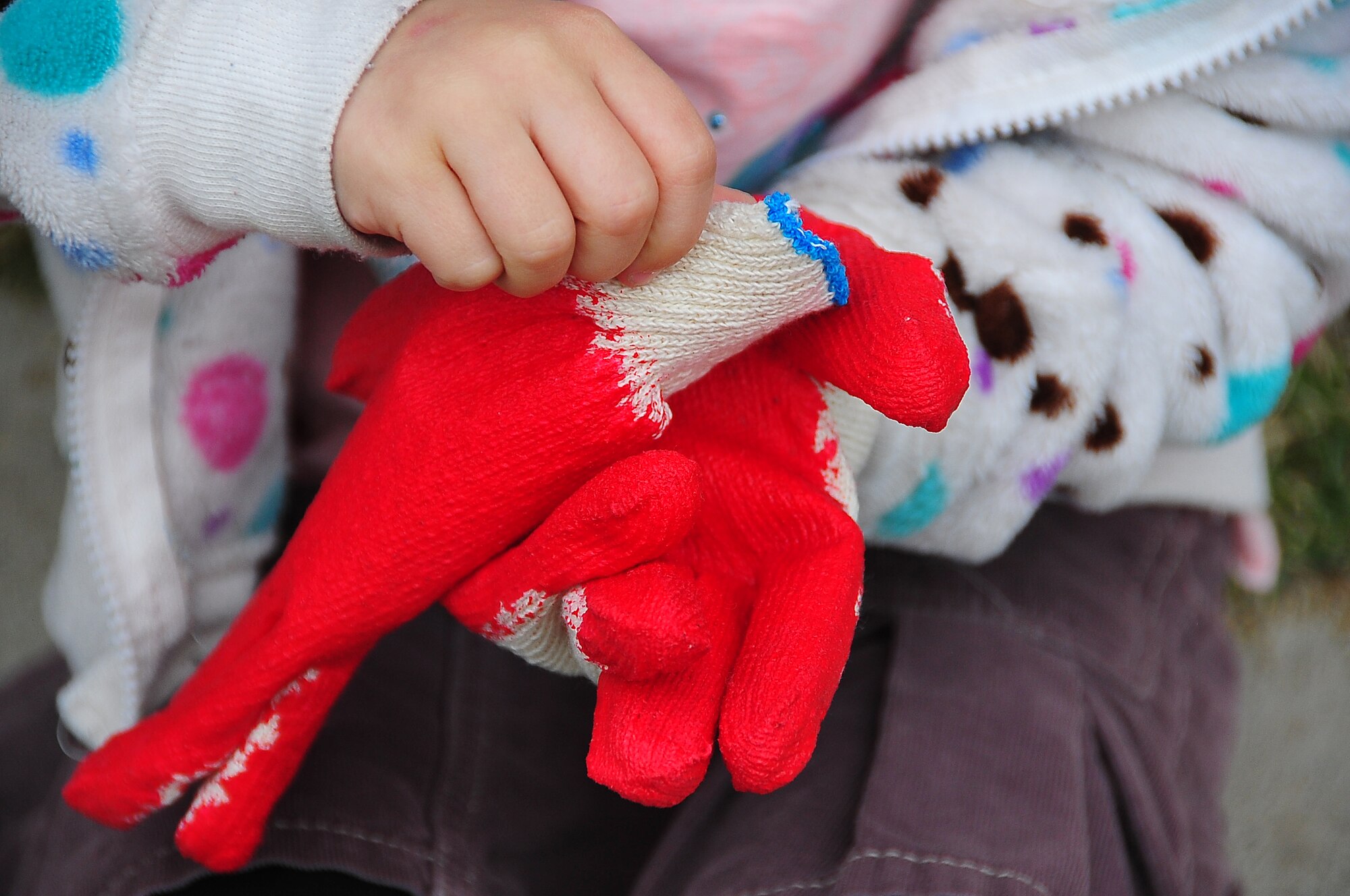 Osan Girl Scouts honored Arbor day/Earth Day by planting 200 yellow pansies and 10 evergreen trees here April 21.  Before the planting, each scout received a brief on the history behind Arbor/Earth Day and the importance of its celebration. The flowers and trees were planted near the elementary school's drop off zone.  (U.S. Air Force photo/Staff Sgt. Daylena Gonzalez)