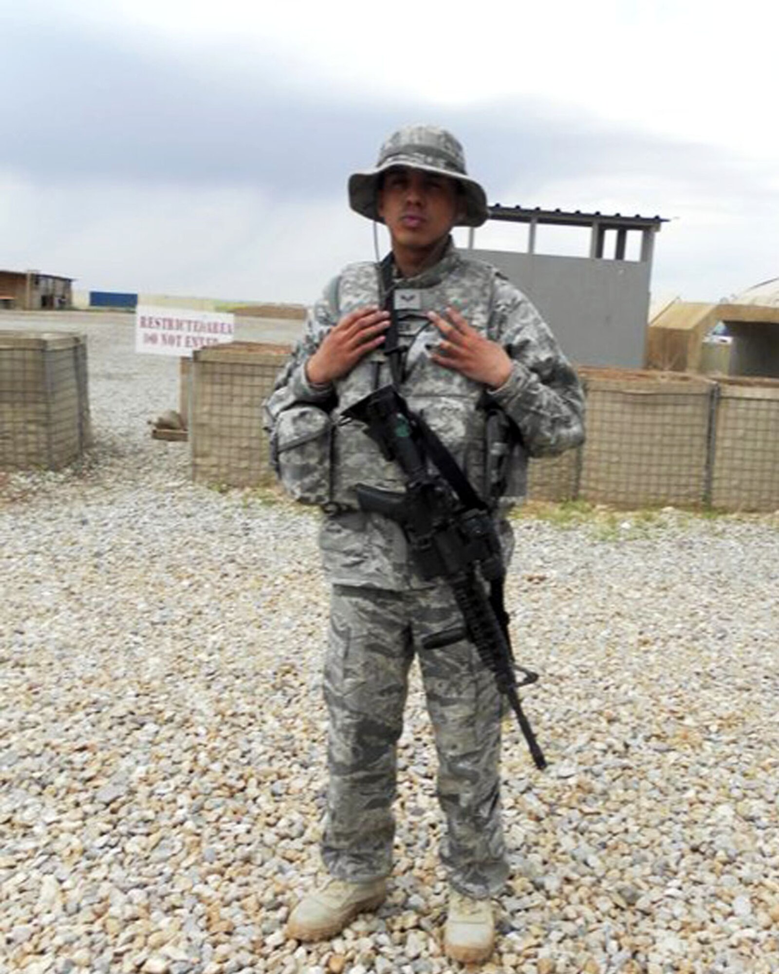 Senior Airman Jon-Nicos Walker, Air Force Financial Management Detachment 2
military pay technician, poses for a photo before going outside the wire
during his deployment at Contingency Operating Site Marez, Iraq. Airman
Walker is deployed from the 319th Comptroller Squadron at Grand Forks Air
Force Base, N.D. (Courtesy photo/Released)