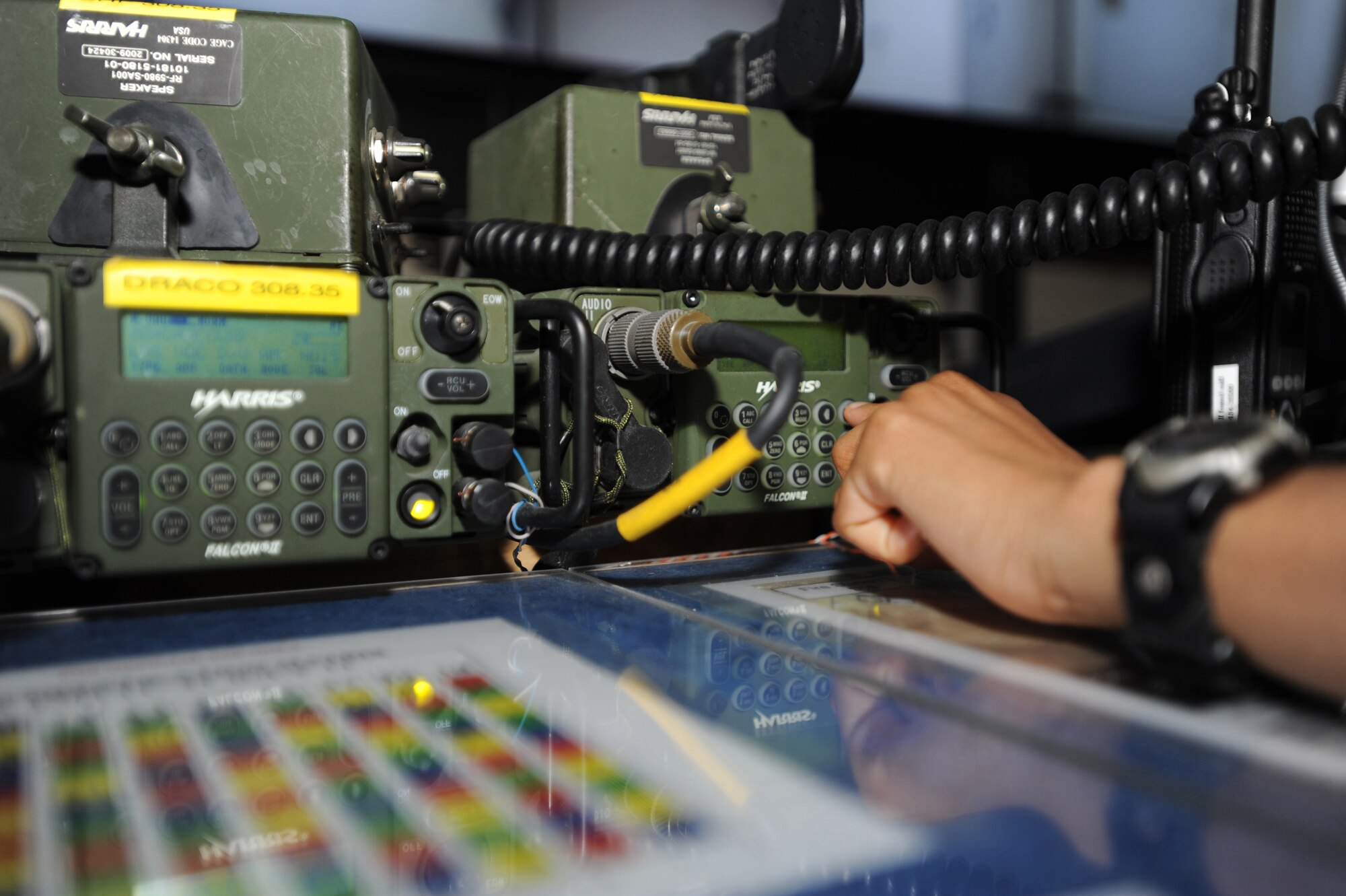 A member of the 380th Air Expeditionary Wing Command Post takes a radio call from an inbound aircraft Mar. 24, 2011. On average, Command Post receives up to 175 radio calls in a span of 24 hours.  (U.S. Air Force photo by Senior Airman Maynelinne De La Cruz)