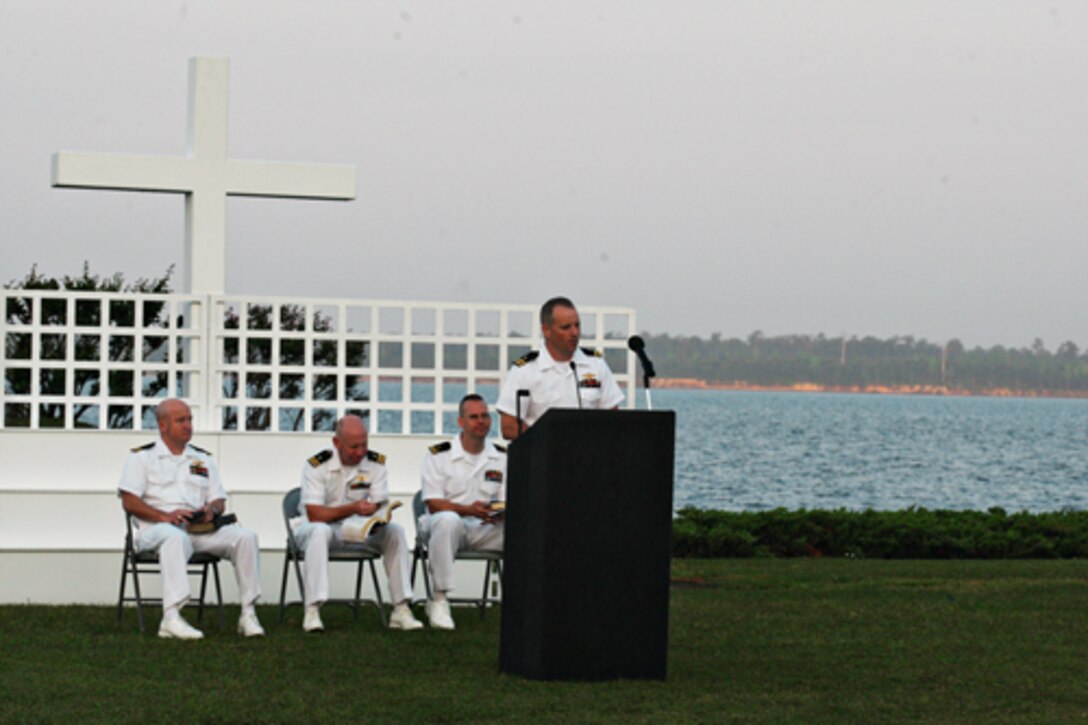 Navy Lt. Ray Rivers, chaplain at the Marine Corps Engineer Center and Courthouse Bay Chapel, speaks to a crowd of more than 90 people as he delivers his sermon during Camp Lejeune’s Easter Resurrection Service behind the 2nd Marine Logistics Group Headquarters building aboard Marine Corps Base Camp Lejeune, Sunday.::r::::n::