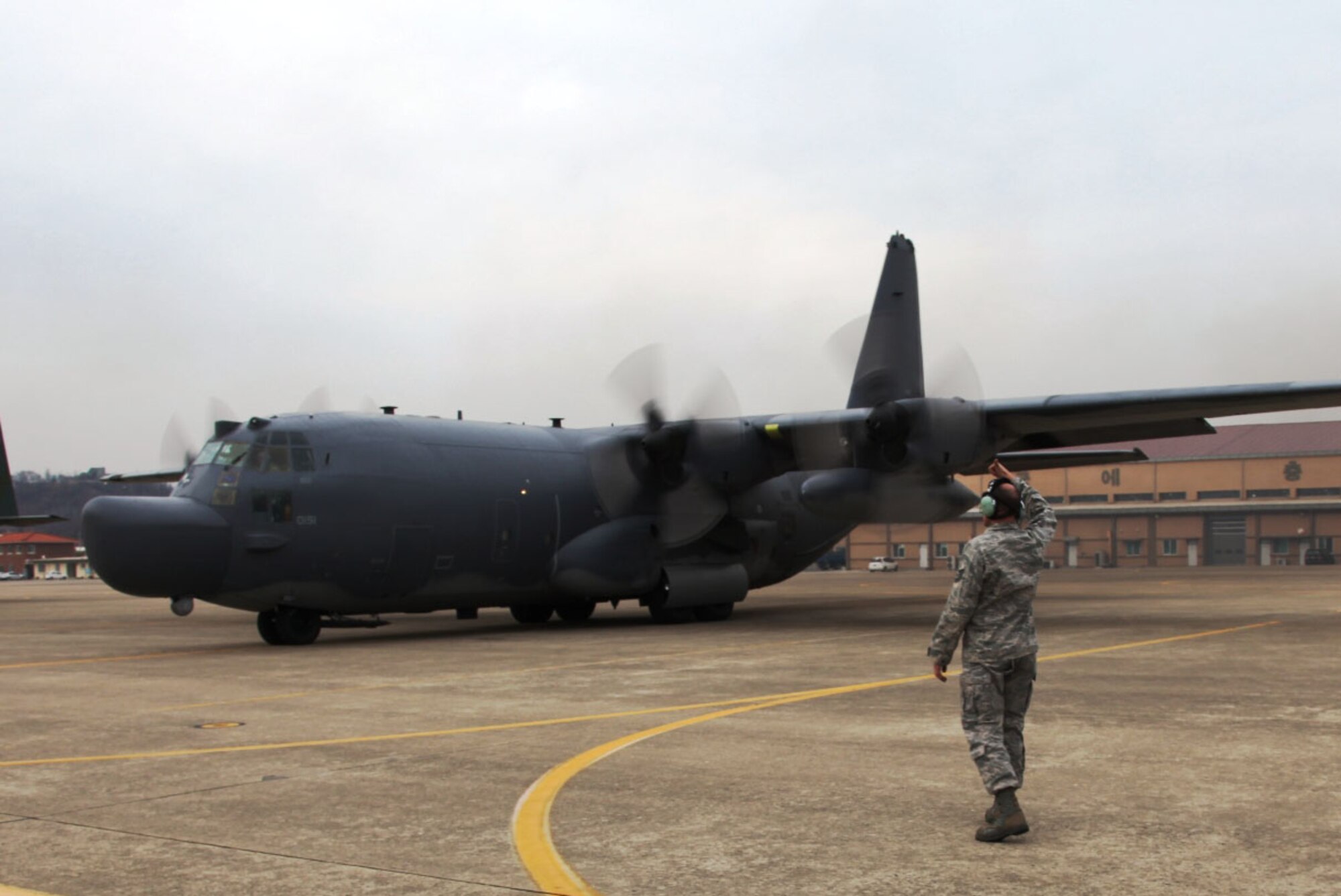 DAEGU AIR BASE, Republic of Korea -- A maintainer from the 353rd Special Operations Maintenance Squadron launches MC-130HCombat Talon II from here March 18. The aircraft is transporting personnel and equipment for relief operations in support of Operation Tomodachi. More than 300 Airmen and six MC-130 aircraft from the 353rd Special Operations Group stationed at Kadena Air Base, Japan, deployed to Daegu Air Base, Republic of Korea, for FOAL EAGLE 2011.  The Airmen also supported Operation Tomodachi from Daegu after half of the force and three MC-130s deployed to Yokota Air Base, Japan, to support relief efforts to for the operation.  (U.S. Air Force photo by Tech. Sgt. Jacob Zapata)