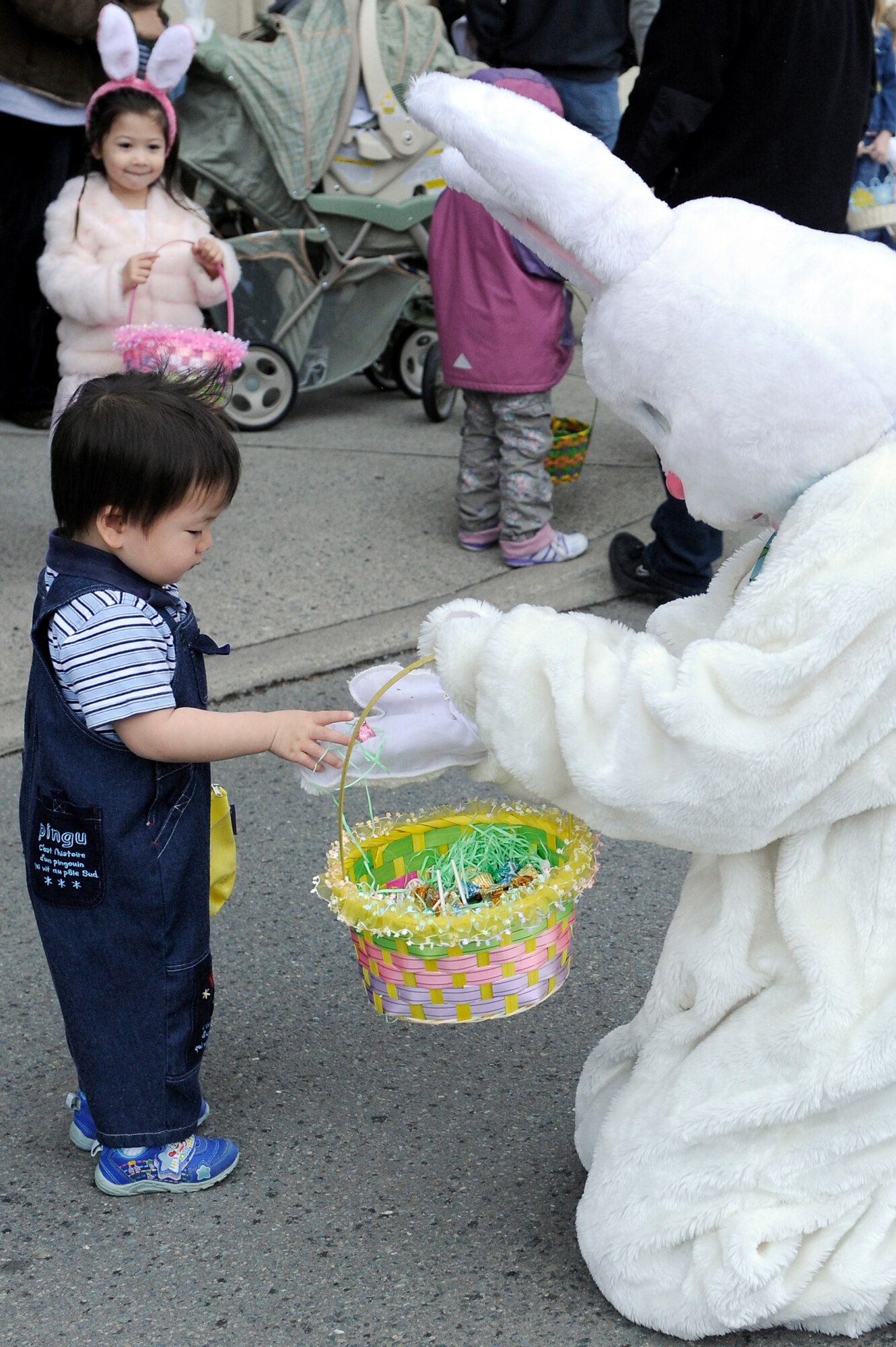 MISAWA AIR BASE, Japan -- Jordan Pho, son of Petty Officer First Class Jin Pho, Navy Intelligence Operations Command, recieves candy from the Easter Bunny 23 April. The event, sponsored by the Base Exchange, included a visit by the Easter Bunny and prizes. (U.S. Air Force photo by Staff Sgt. Marie Brown\Released)