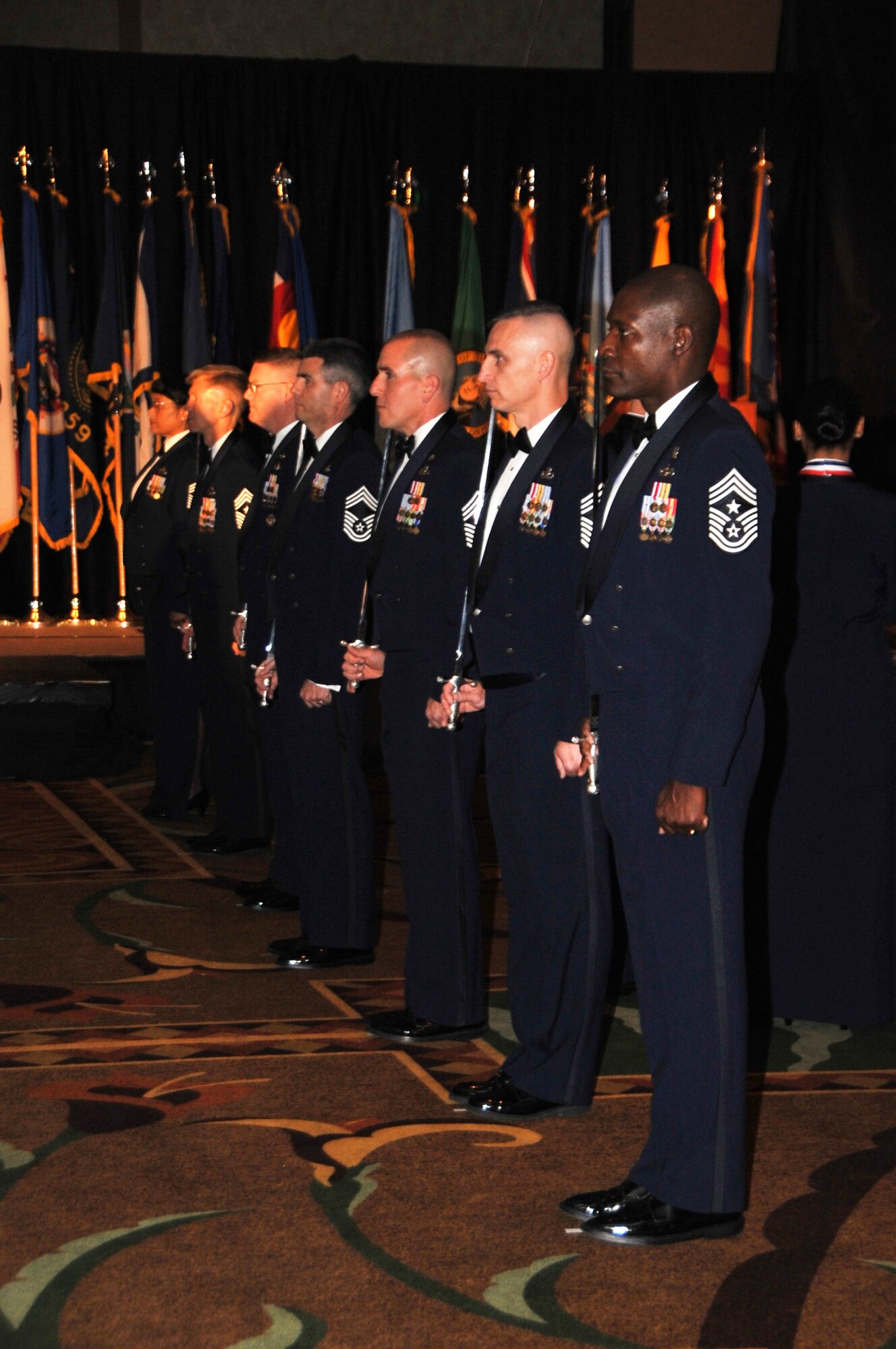 OFFUTT AIR FORCE BASE, Neb.
Chief Master Sgts from various bases in Air Combat Command stand at attention during the Outstanding Airmen of the Year awards. The OAY awards banquet was sponsored by Offutt Air Force Base and was held in Embassy Suites hotel in Omaha April 20. 
U.S. Air Force Photo by D.P. Heard
[RELEASED] by SrA Peter Danielson
