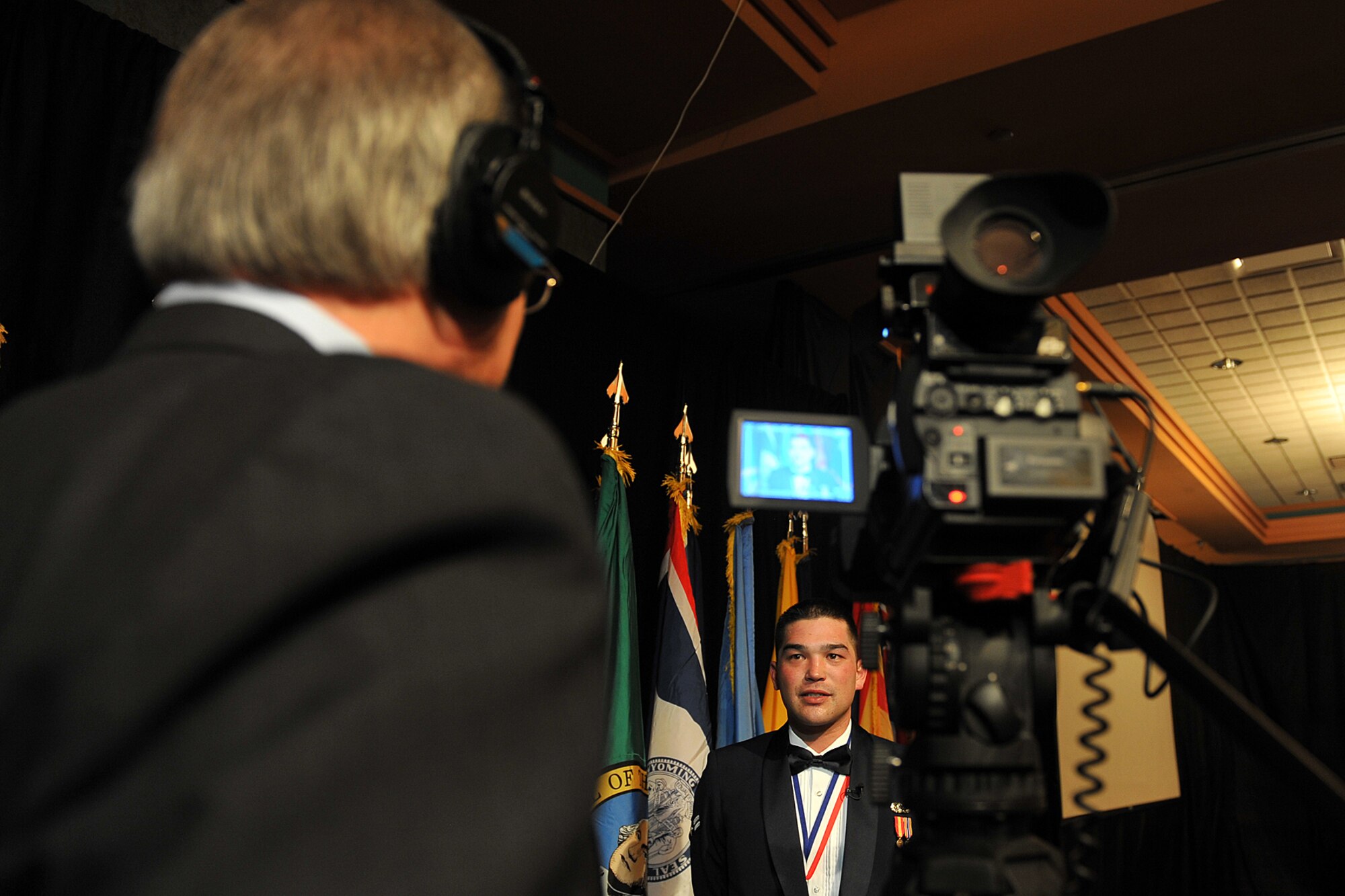 OFFUTT AIR FORCE BASE, Neb. – Kevin Schwandt, audio visual technician with the 55th Wing Public Affairs, interviews Airman 1st Class Iori Osawa, Shaw AFB, S.C., after he wins outstanding honor guard award during the Air Combat Command Outstanding Airmen of the Year banquet at the Embassy Suites hotel in Omaha April 21. More than 250 people were in attendance to honor ACC’s most talented Airmen for their dedication, sacrifice and service that defines the goal of global power for America.    

U.S. Air Force Photo by charles haymond
[RELEASED] by SrA Peter Danielson
