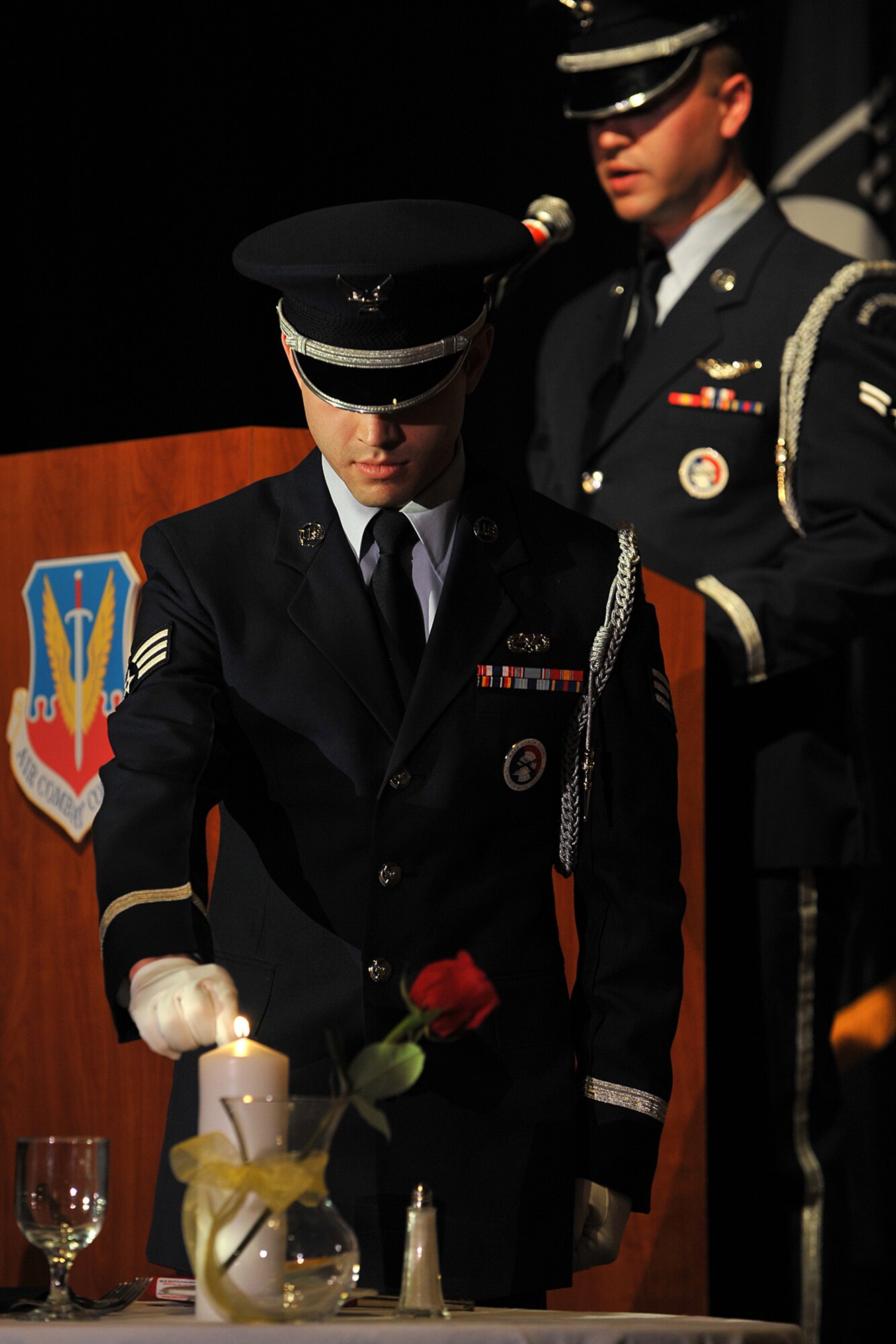 OFFUTT AIR FORCE BASE, Neb. – Airman 1st Class Brian Lucas speaks to the crowd while Senior Airman David Landrum lights a candle during POW/MIA ceremony inside the Embassy Suite hotel in Omaha April 20. More than 250 people were in attendance to honor ACC’s most talented Airmen for their dedication, sacrifice and service that defines the goal of global power for America.   

U.S. Air Force Photo charles haymond
[RELEASED] by SrA Peter Danielson
